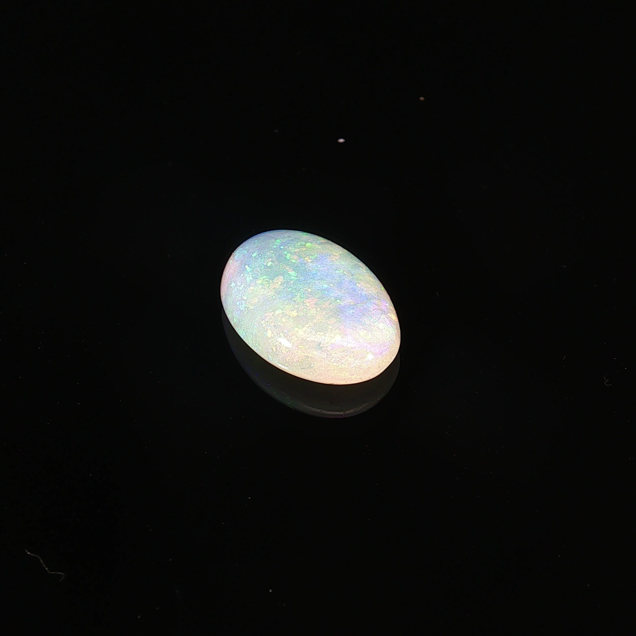 Natural Australian crystal opal, 5.54ct oval cabochon 18x11mm, translucent with pastel play-of-colour