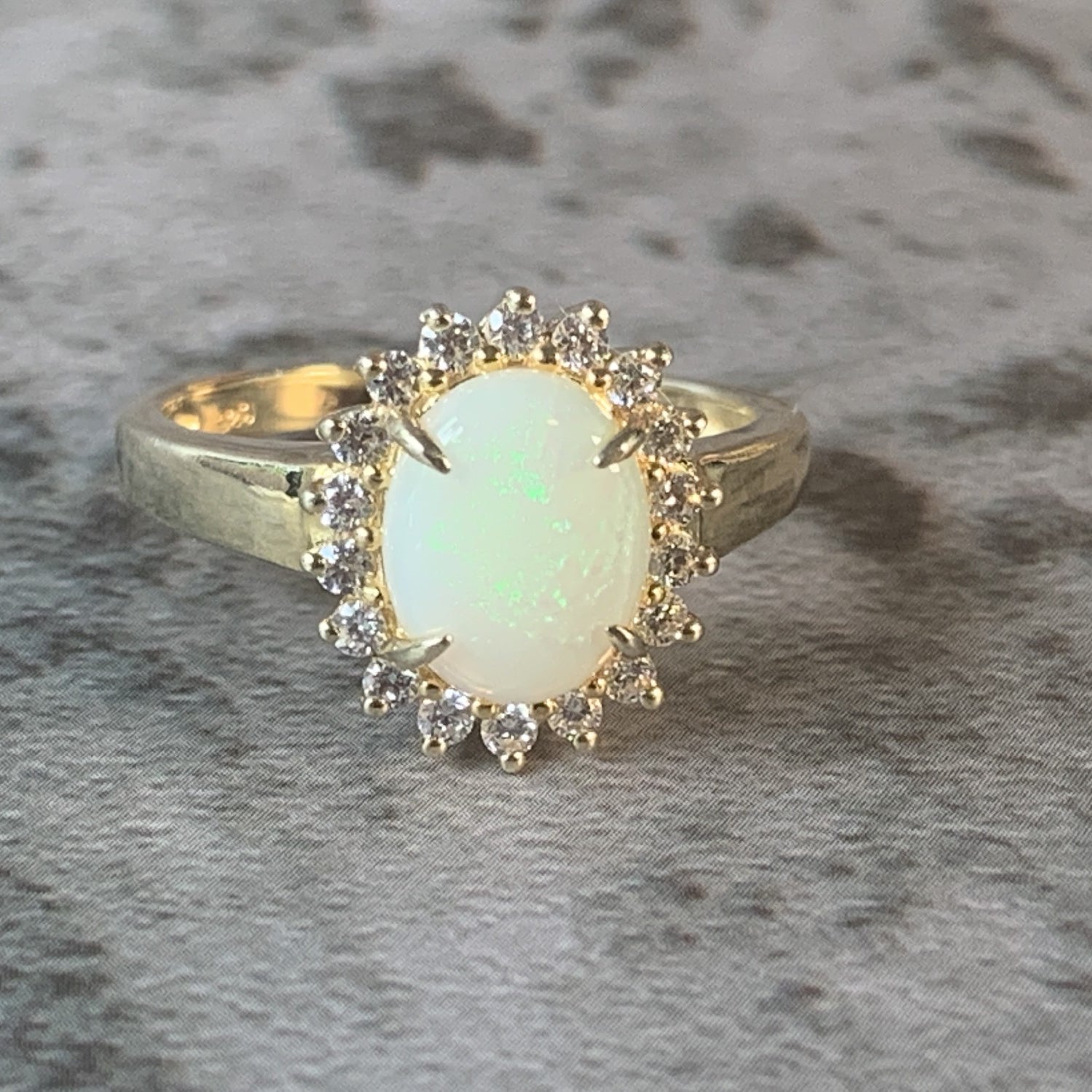 Gold Plated Silver 9x7mm White Opal and cubic zirconia Halo ring