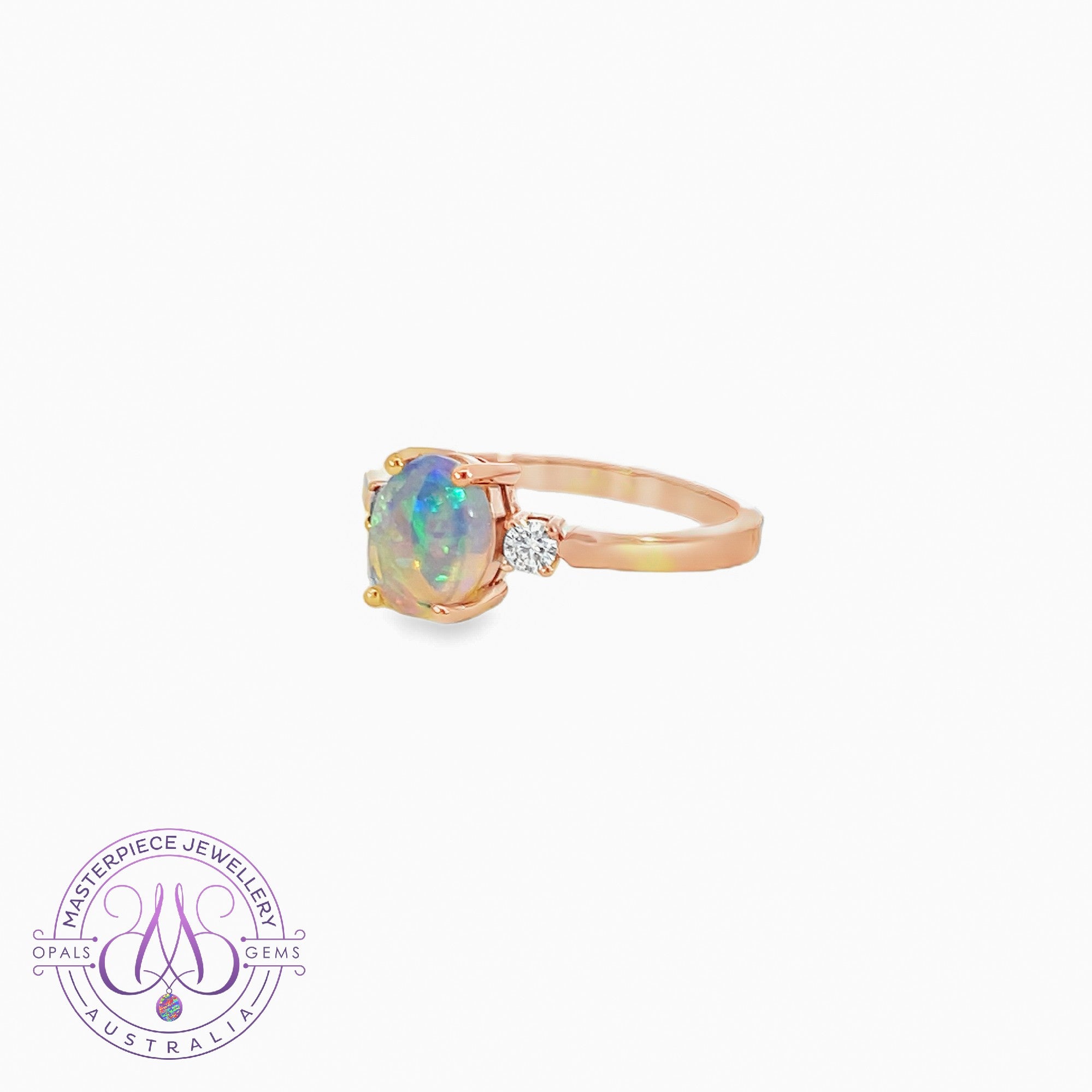 18kt Rose Gold 3 stone ring set with one Black Opal 1.35 and 2 diamonds