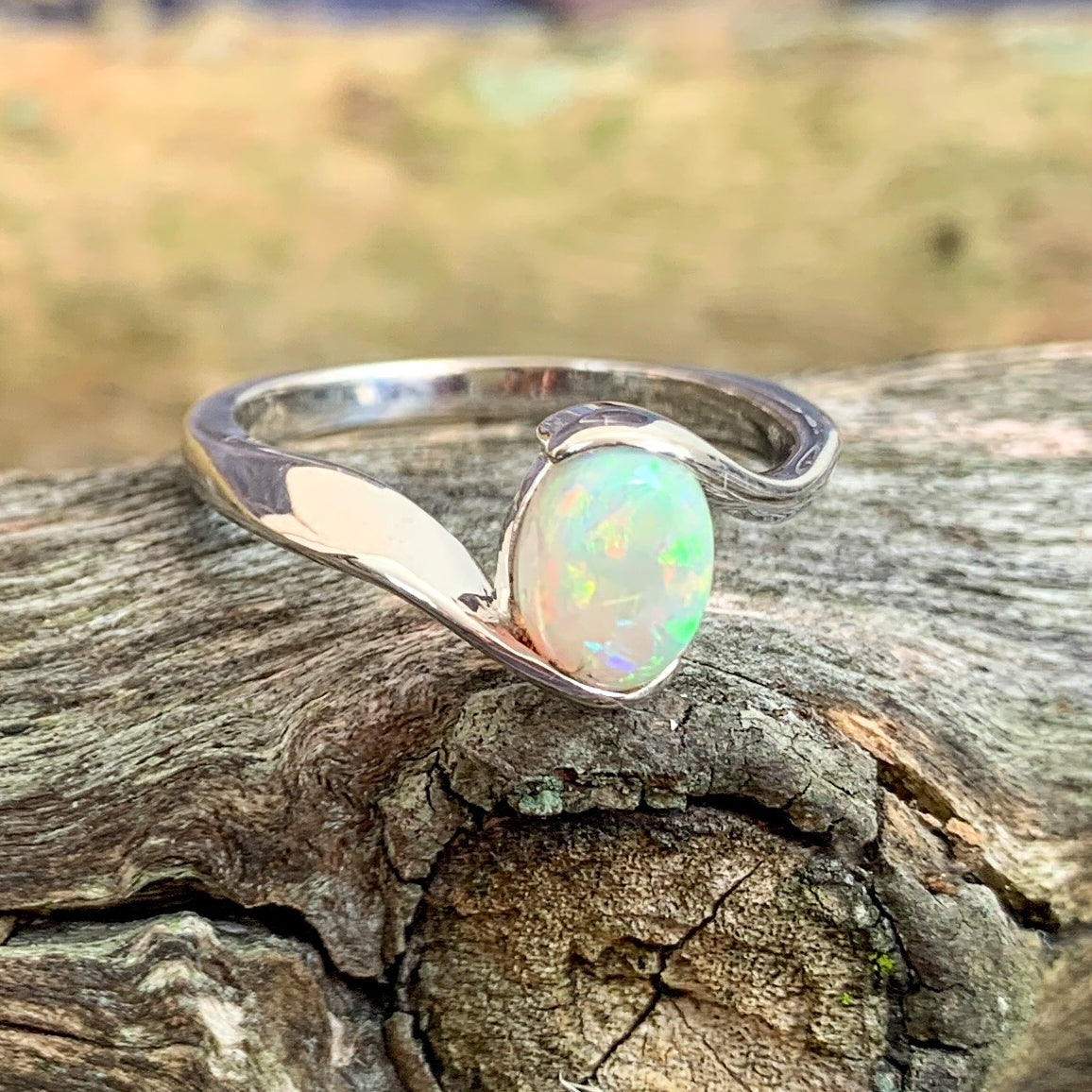 14kt White Gold solitaire cross over ring with 0.7ct Semi Black Opal - Masterpiece Jewellery Opal & Gems Sydney Australia | Online Shop