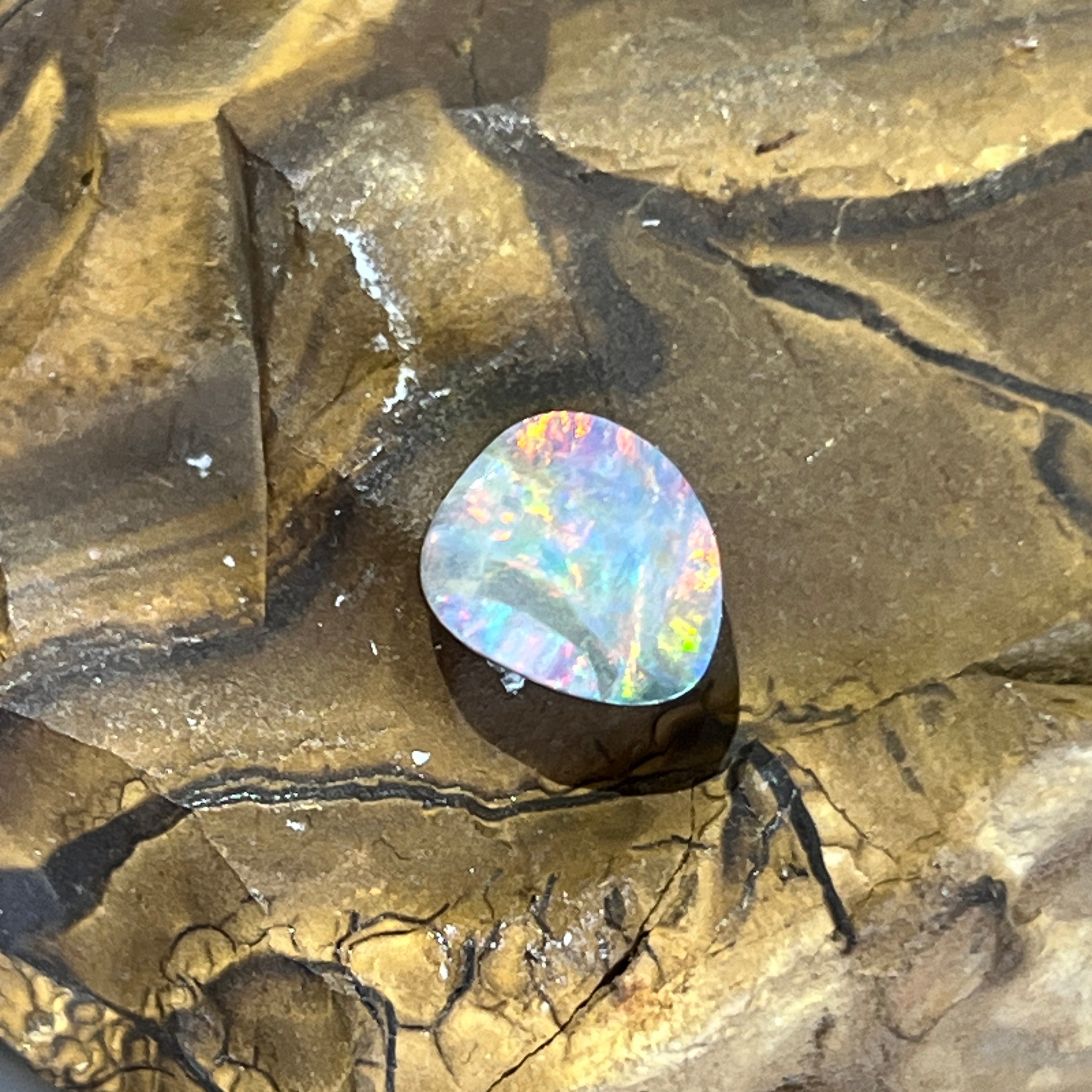 2.3ct Australian boulder opal close up, pink and green play of colour across the face
