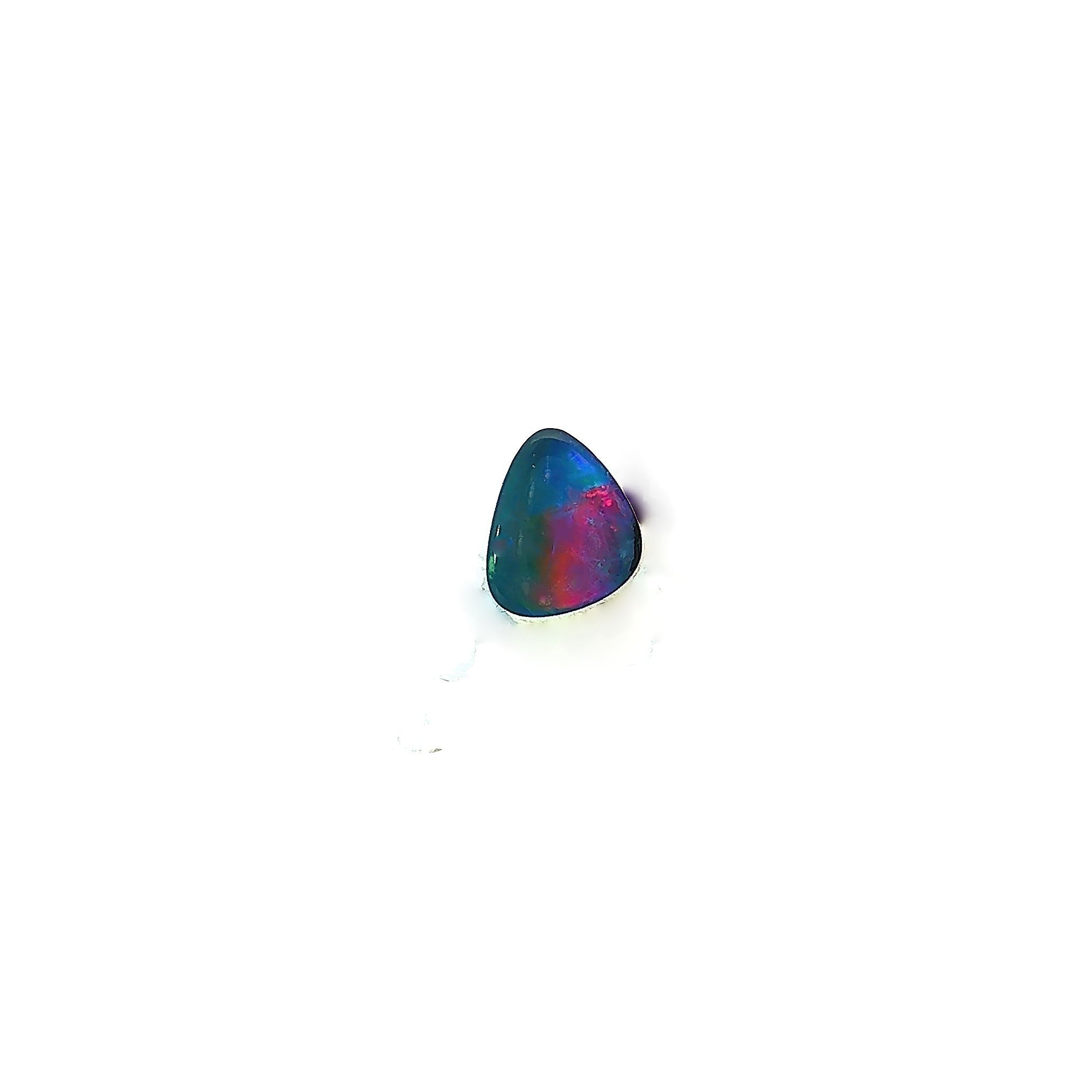 Australian opal doublet 0.70ct freeform, magenta flash over dark blue, on a white background