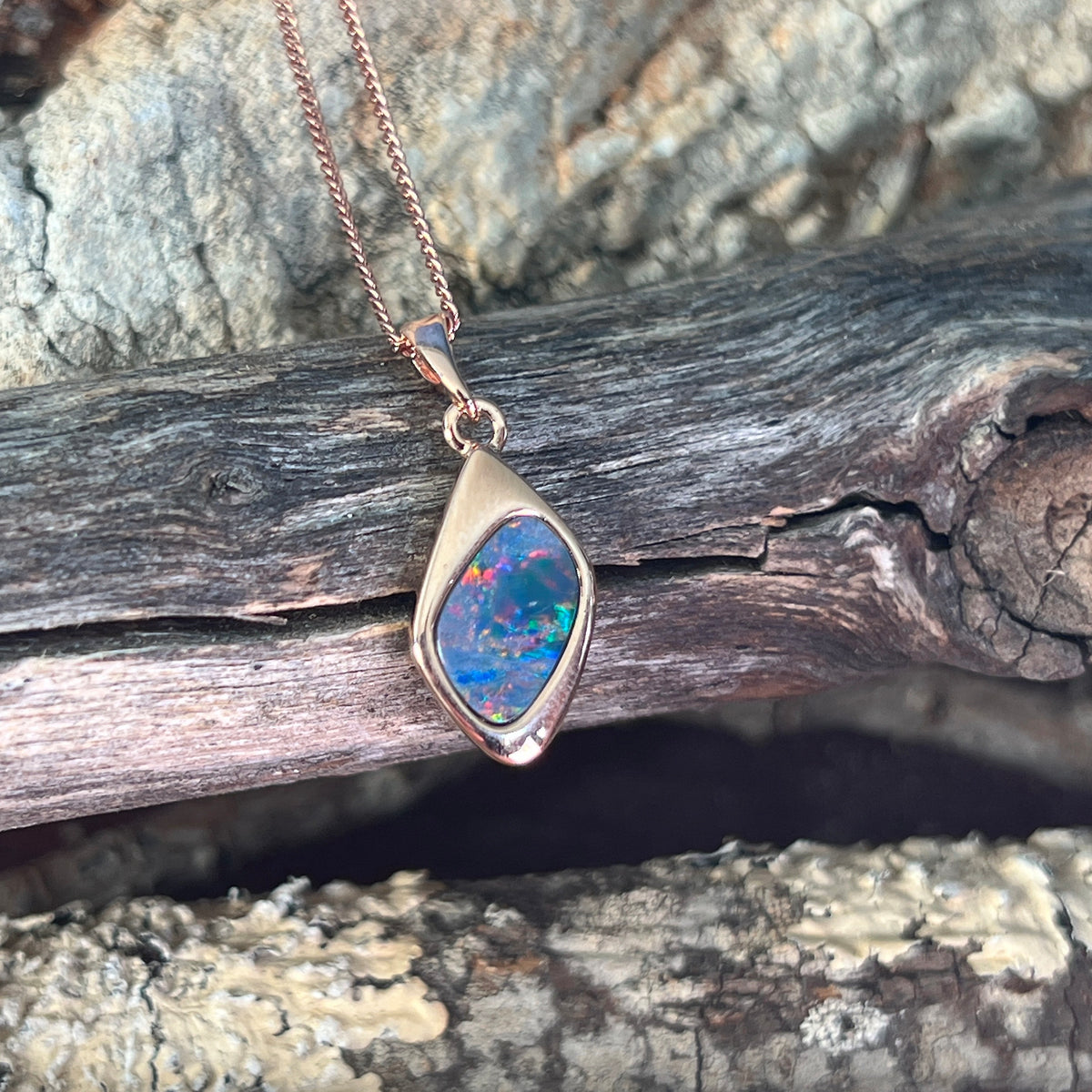 12 x 9mm Australian opal doublet pendant in rose gold-plated silver, red, blue and green