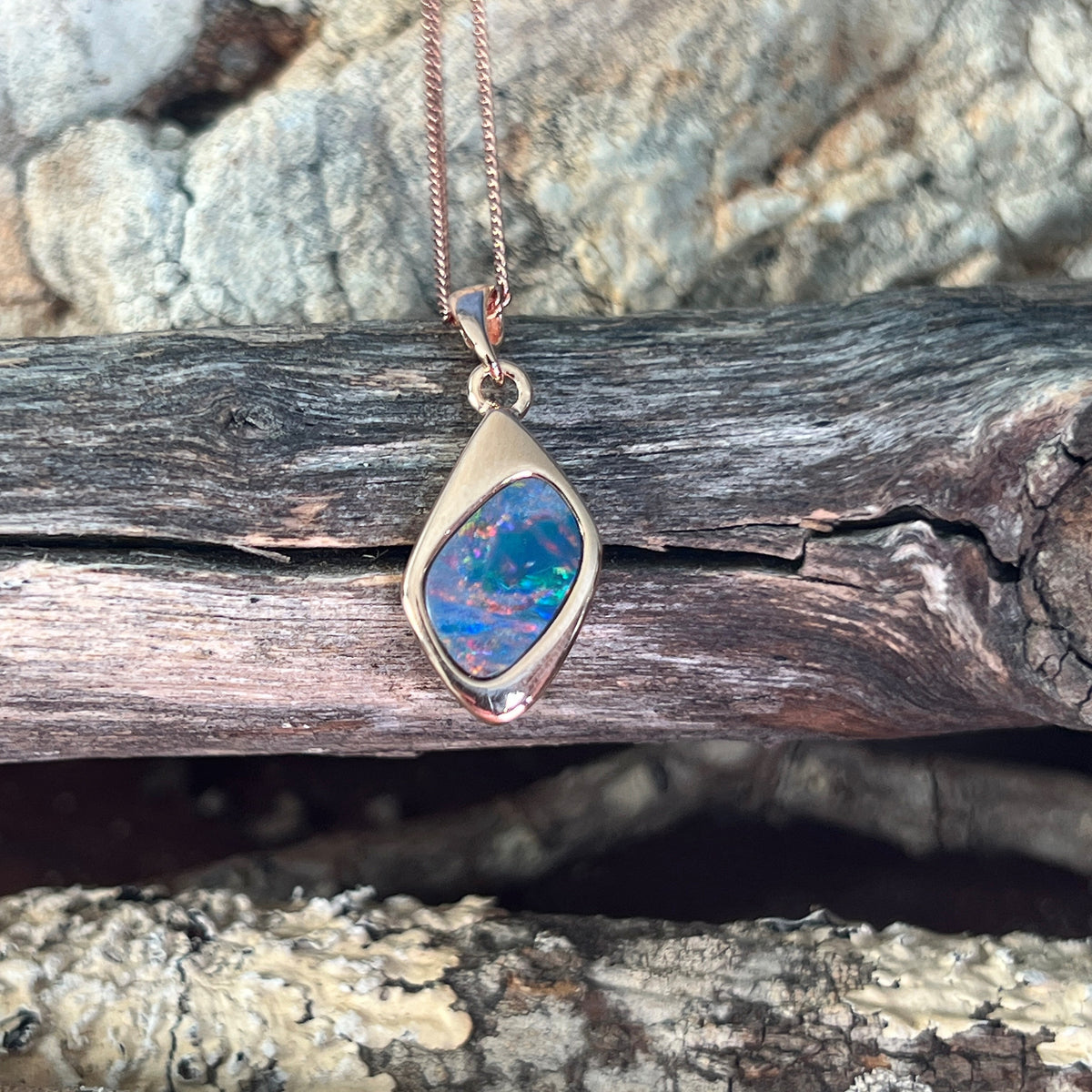 Australian opal doublet pendant, rose gold-plated silver, 12 x 9mm stone showing red, blue and green