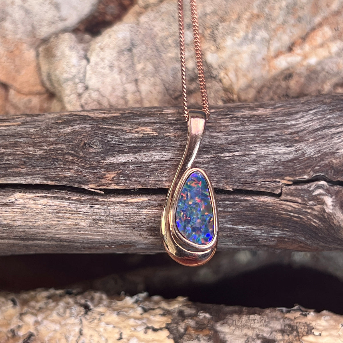 freeform Australian opal doublet pendant in rose gold-plated silver, green, orange and violet play-of-colour