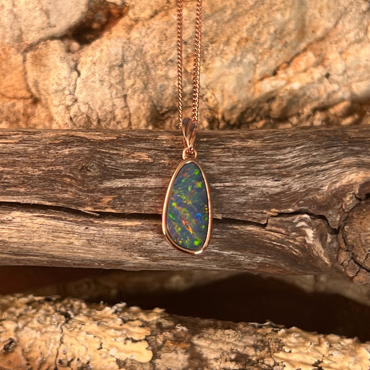 Australian opal doublet pendant, rose gold-plated silver, 15 x 7.5mm stone showing red, blue, green and violet
