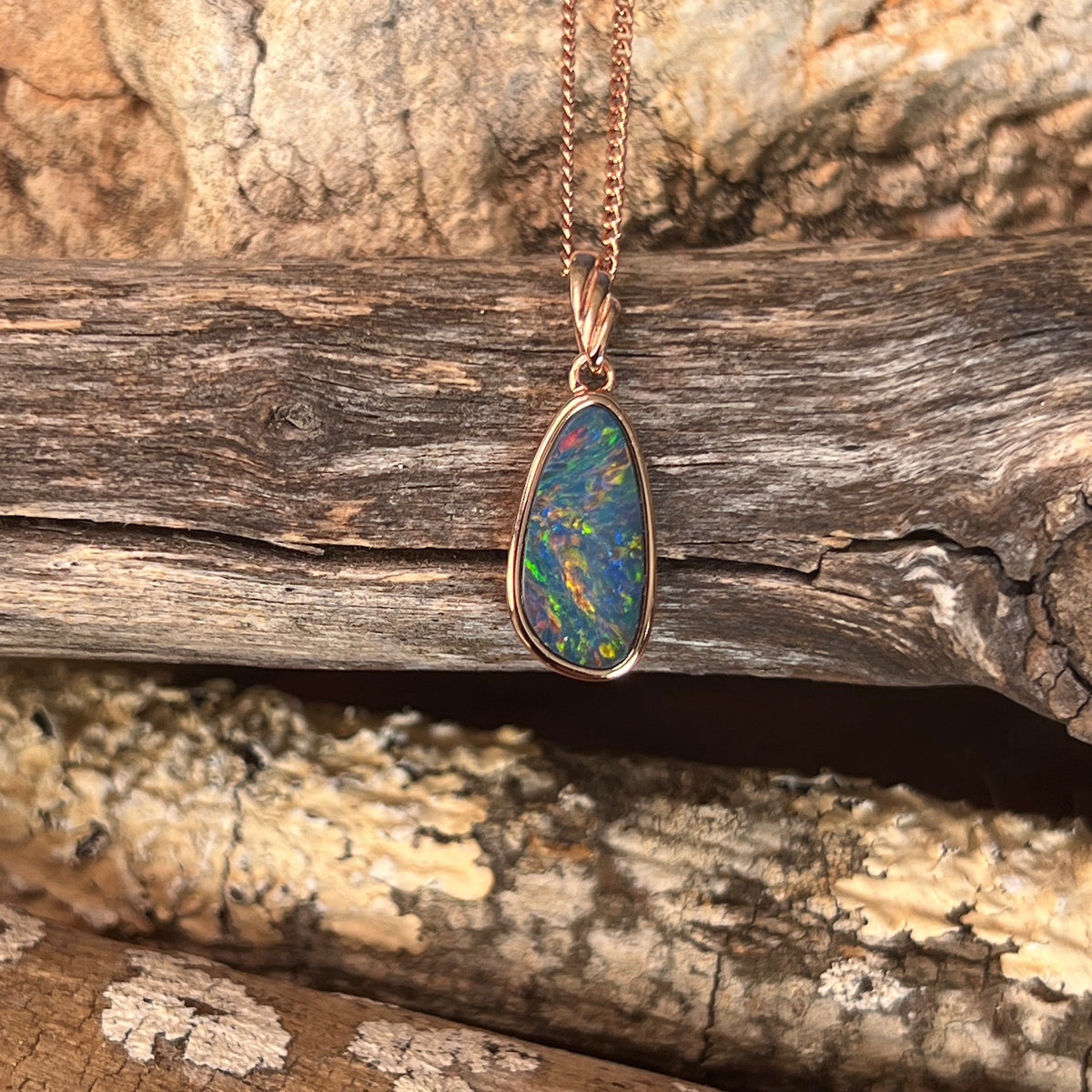 Australian opal doublet pendant, rose gold-plated silver, marquise 15 x 7.5mm stone, red, blue, green and violet