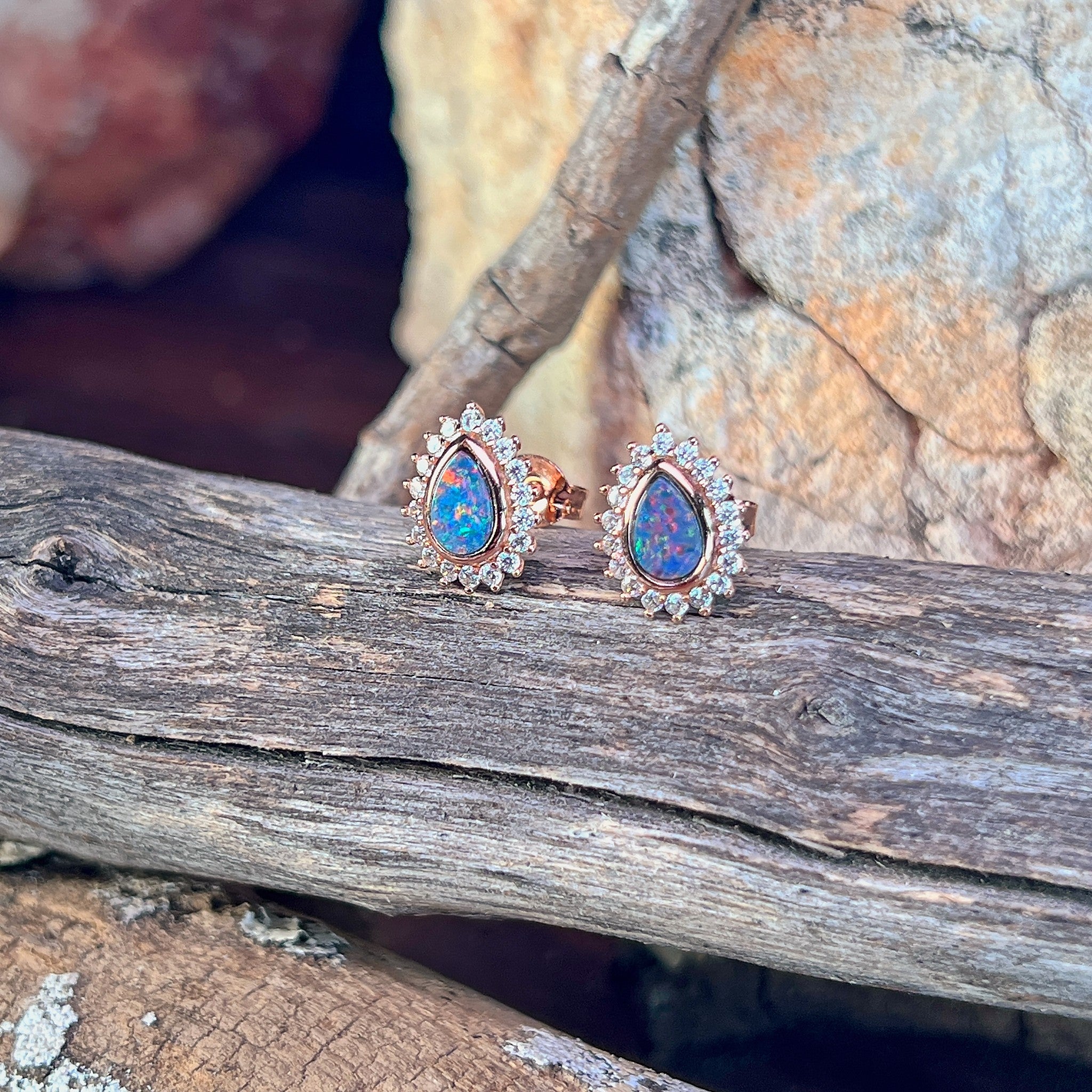 red, blue and green play-of-colour in 7 x 5mm pear-shaped Australian opal doublet earrings
