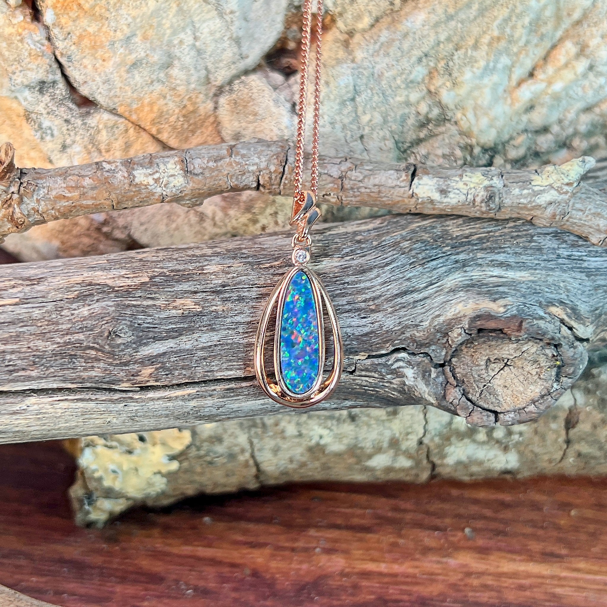 16.5 x 5.5mm Australian opal doublet pendant in rose gold-plated silver, blue, yellow, green and red