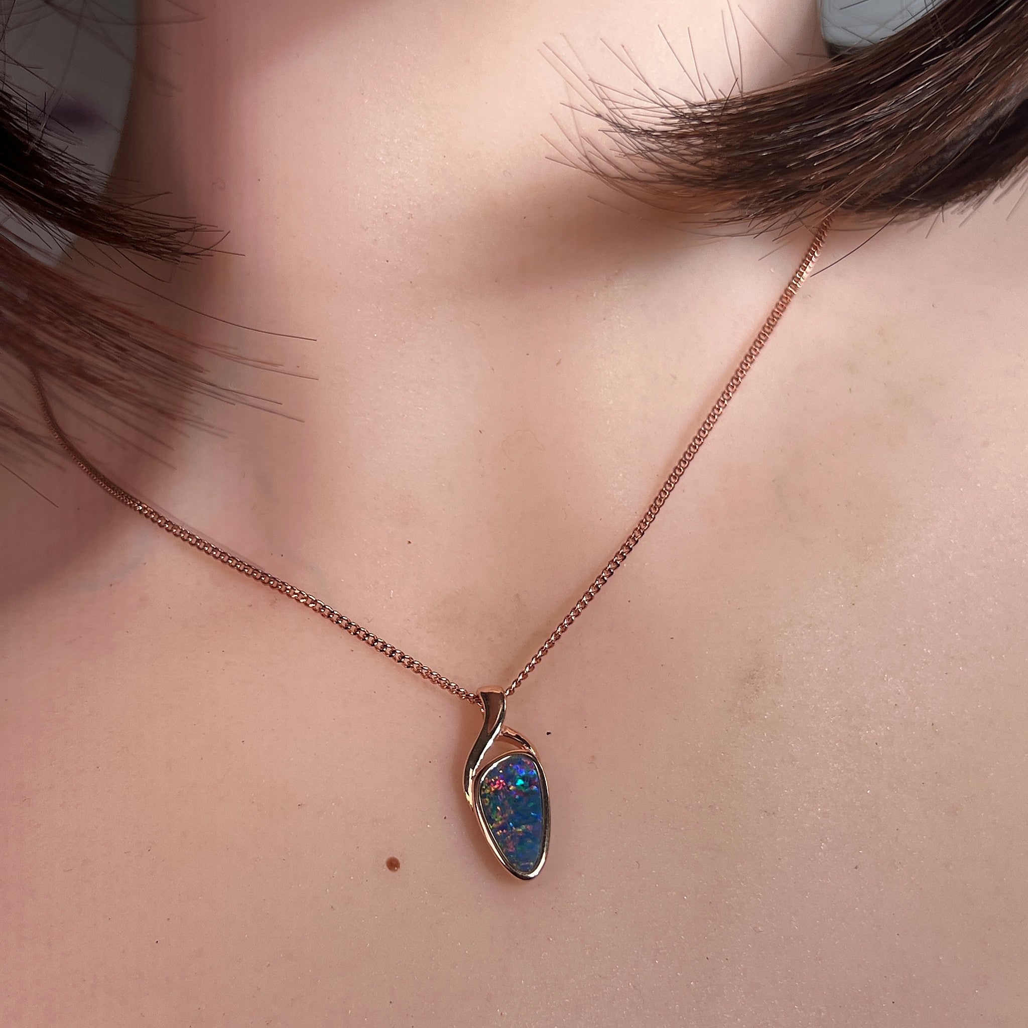 Australian opal doublet pendant worn at the neck, rose gold-plated silver, 11 x 5.5mm triangular stone
