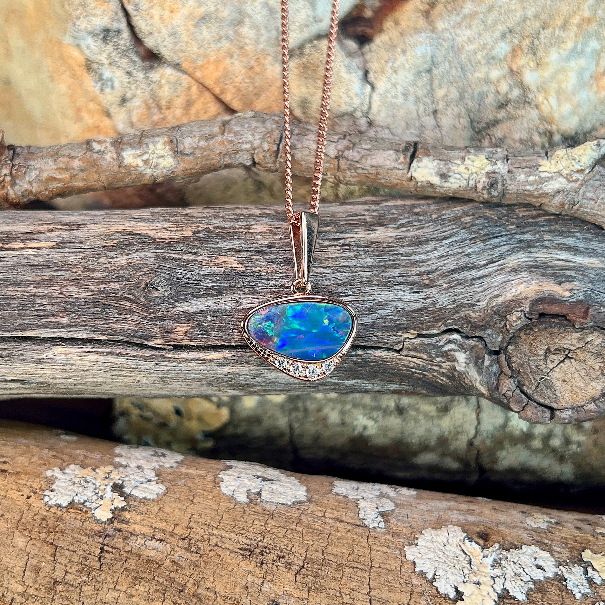 Australian opal doublet pendant, rose gold-plated silver, 13 x 7mm stone showing blue, yellow, green and red