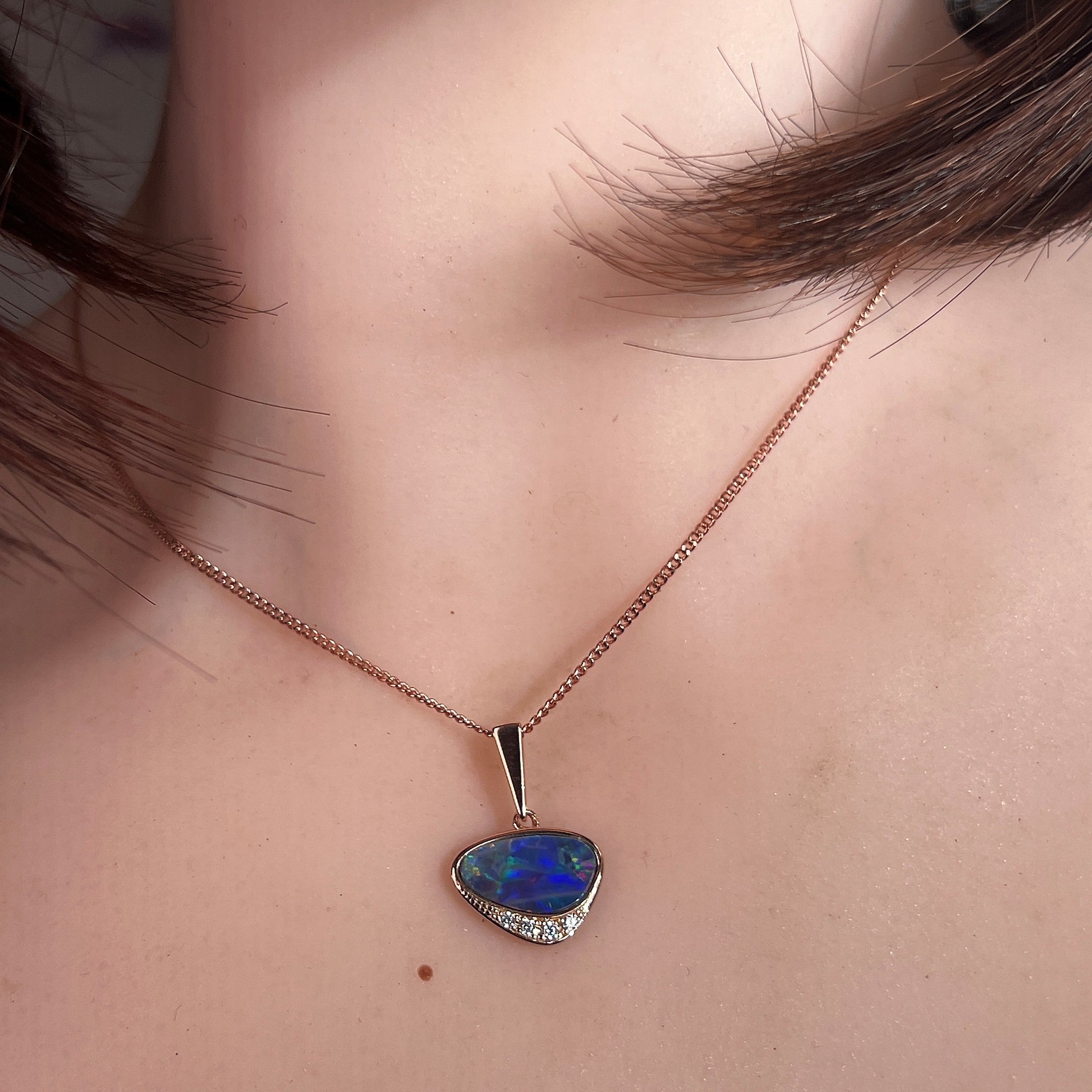 Australian opal doublet pendant worn at the neck, rose gold-plated silver, 13 x 7mm triangular stone