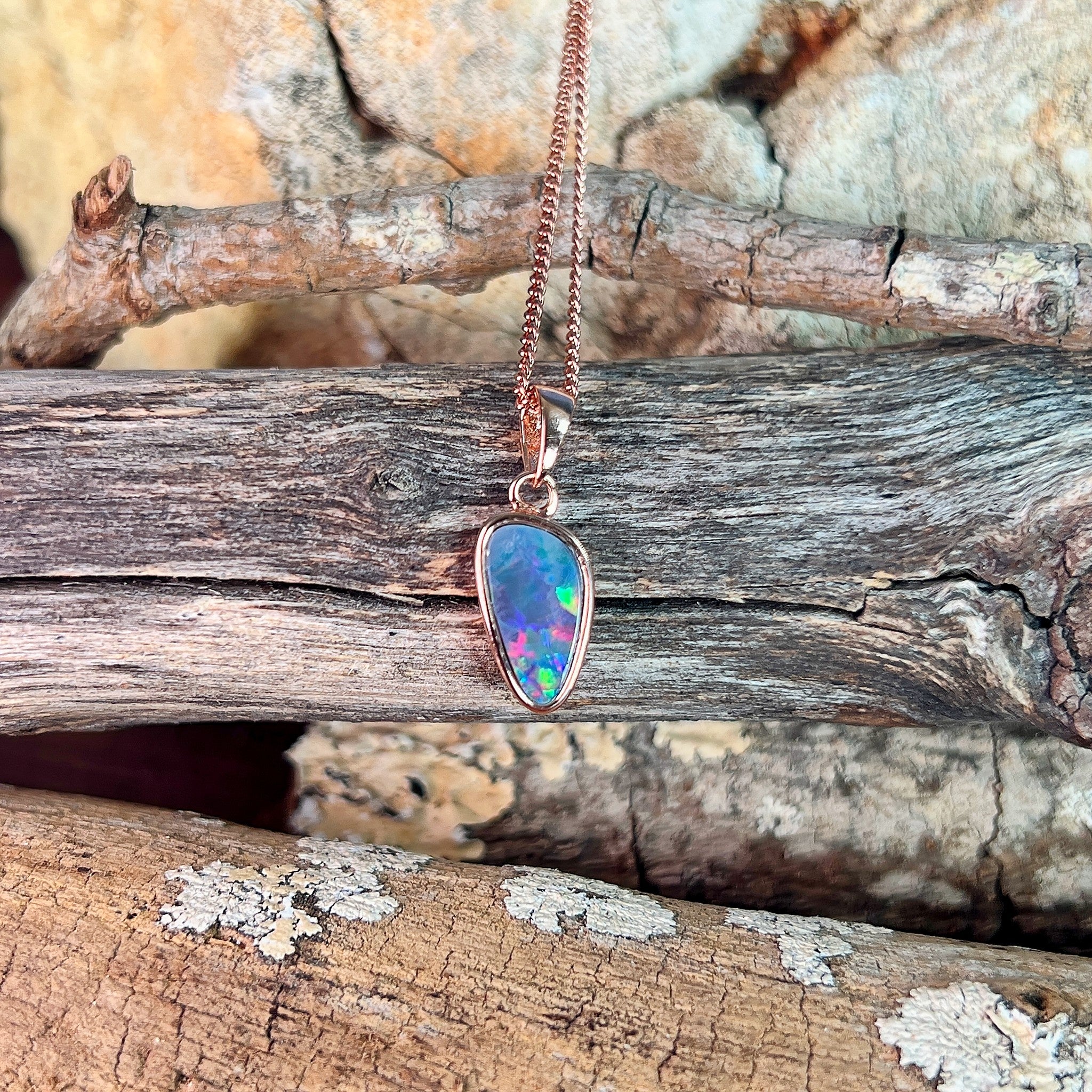 triangular Australian opal doublet pendant in rose gold-plated silver, red, green and blue play-of-colour