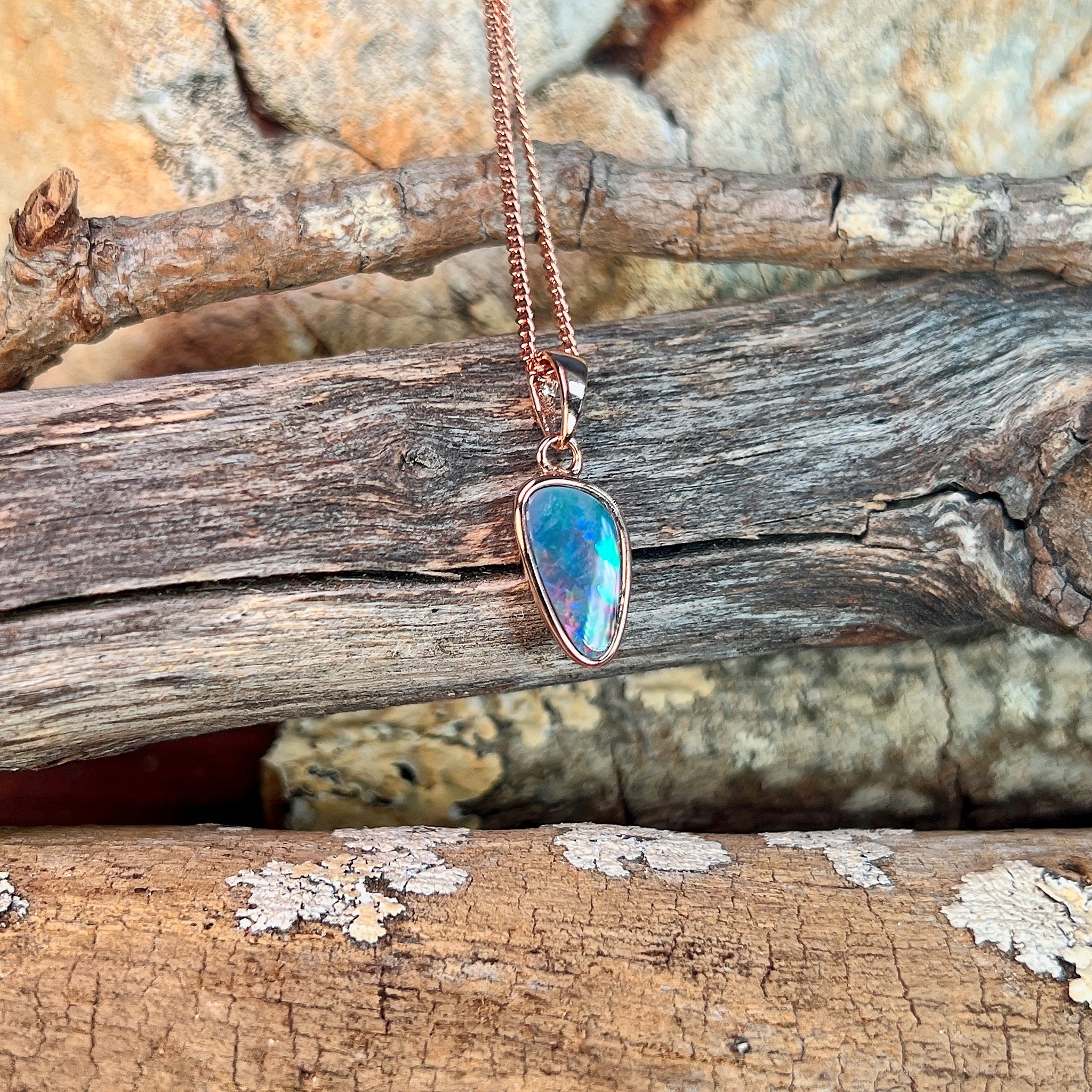 rose gold-plated silver Australian opal doublet pendant with a 12 x 6.5mm triangular stone