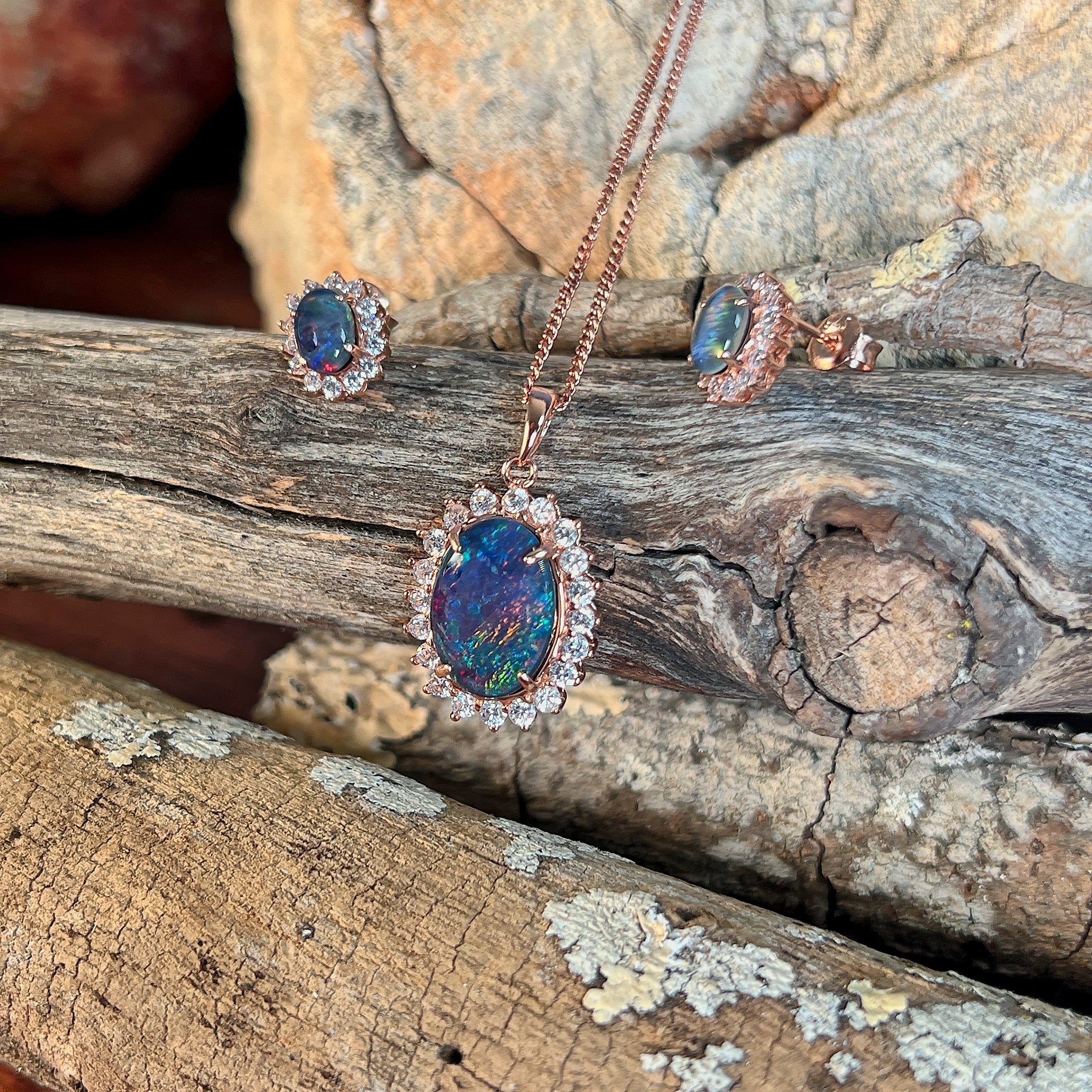 red, blue and green play-of-colour in a 14 x 10mm oval Australian opal triplet pendant and earring set