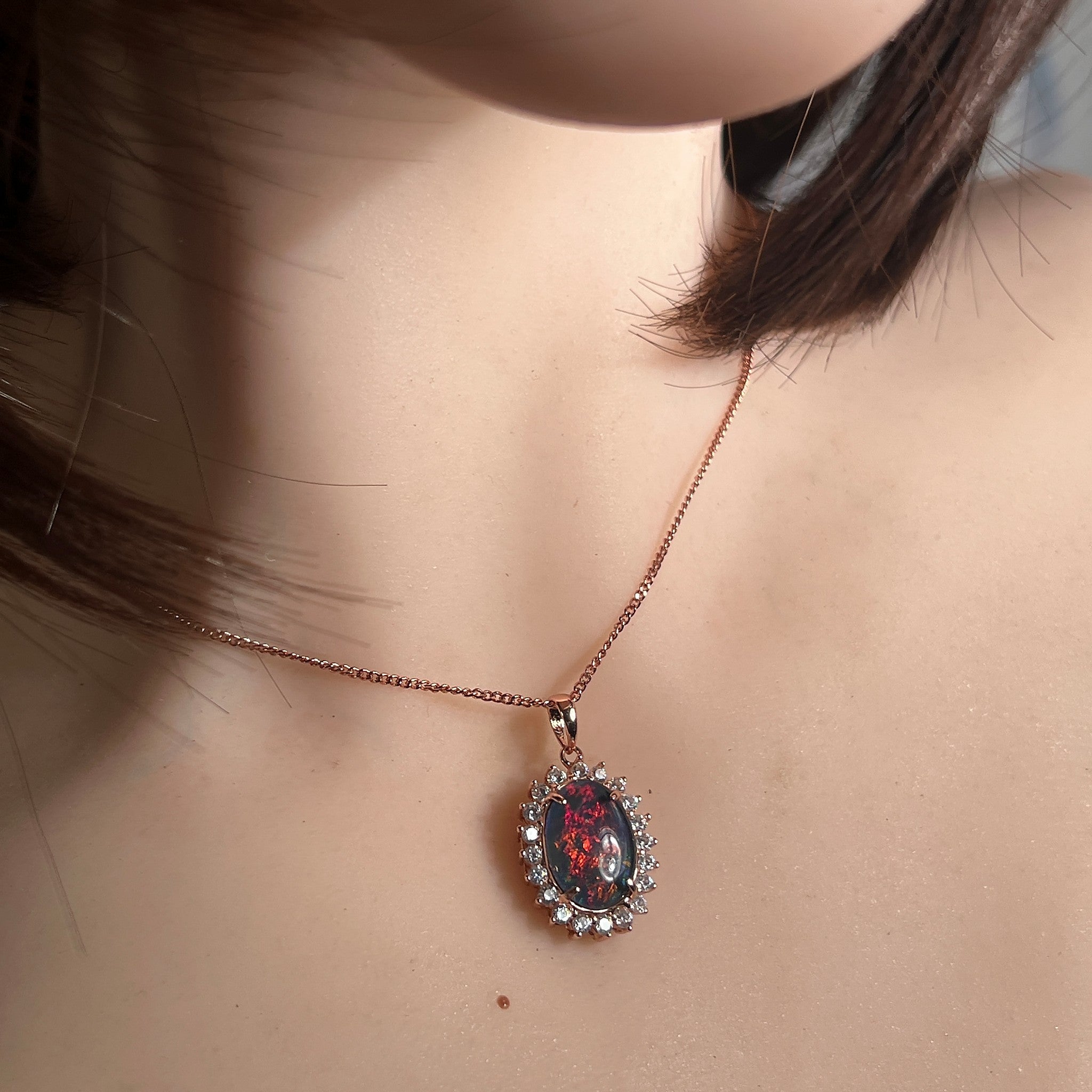 Australian opal triplet pendant and earring set worn, rose gold-plated silver, 14 x 10mm oval stone