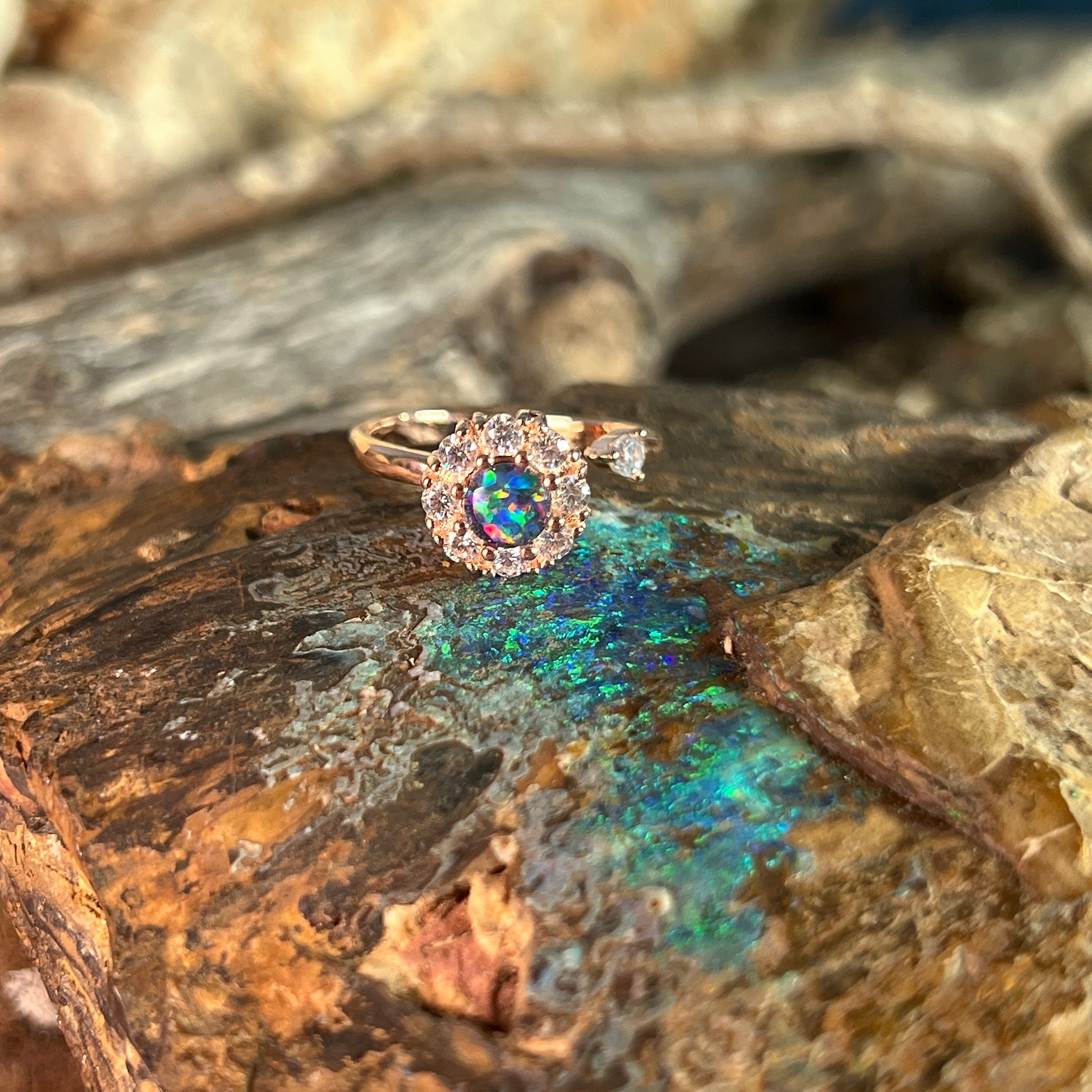 red, blue and green play-of-colour in a 5mm round Australian opal triplet ring