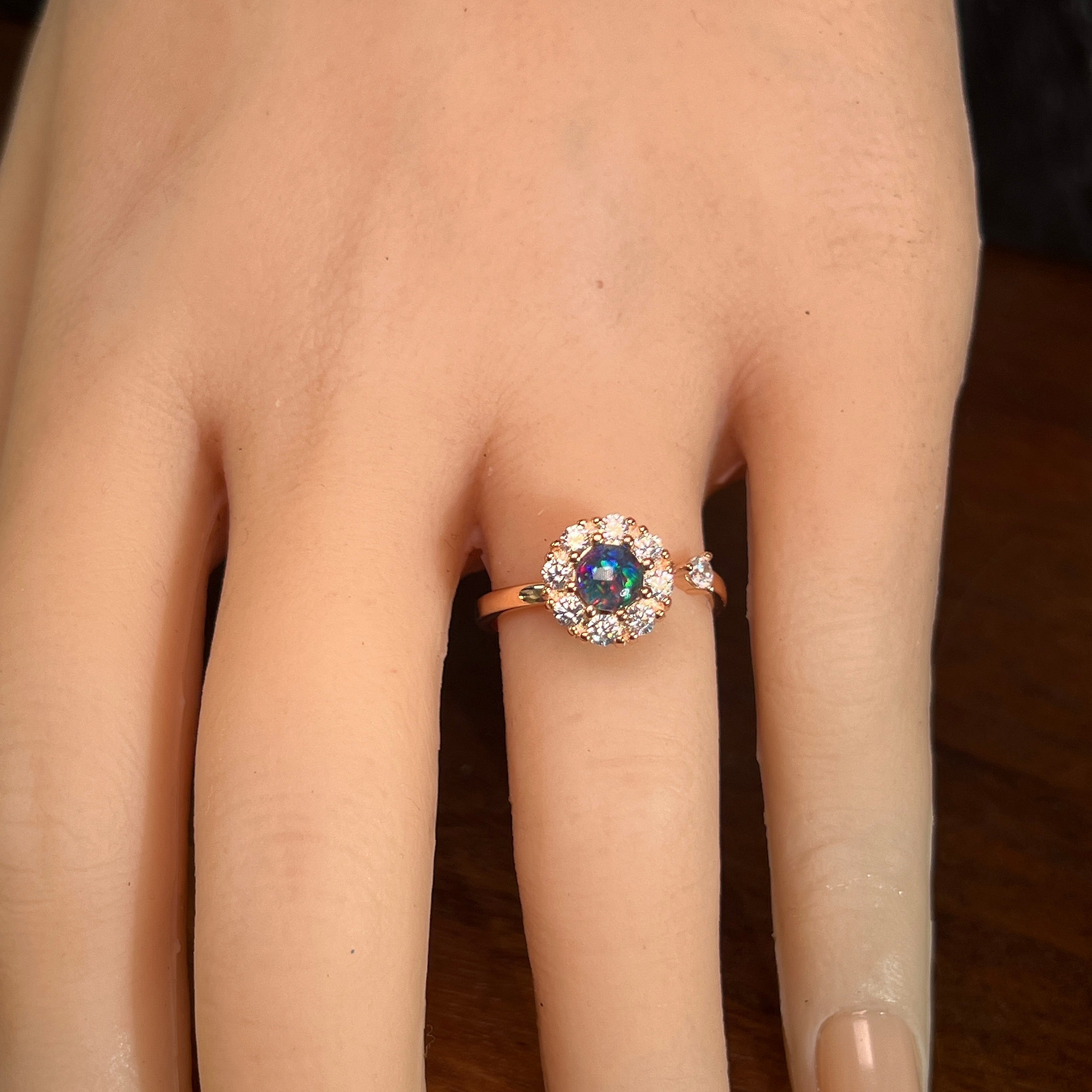 round Australian opal triplet ring in rose gold-plated silver, worn on the hand