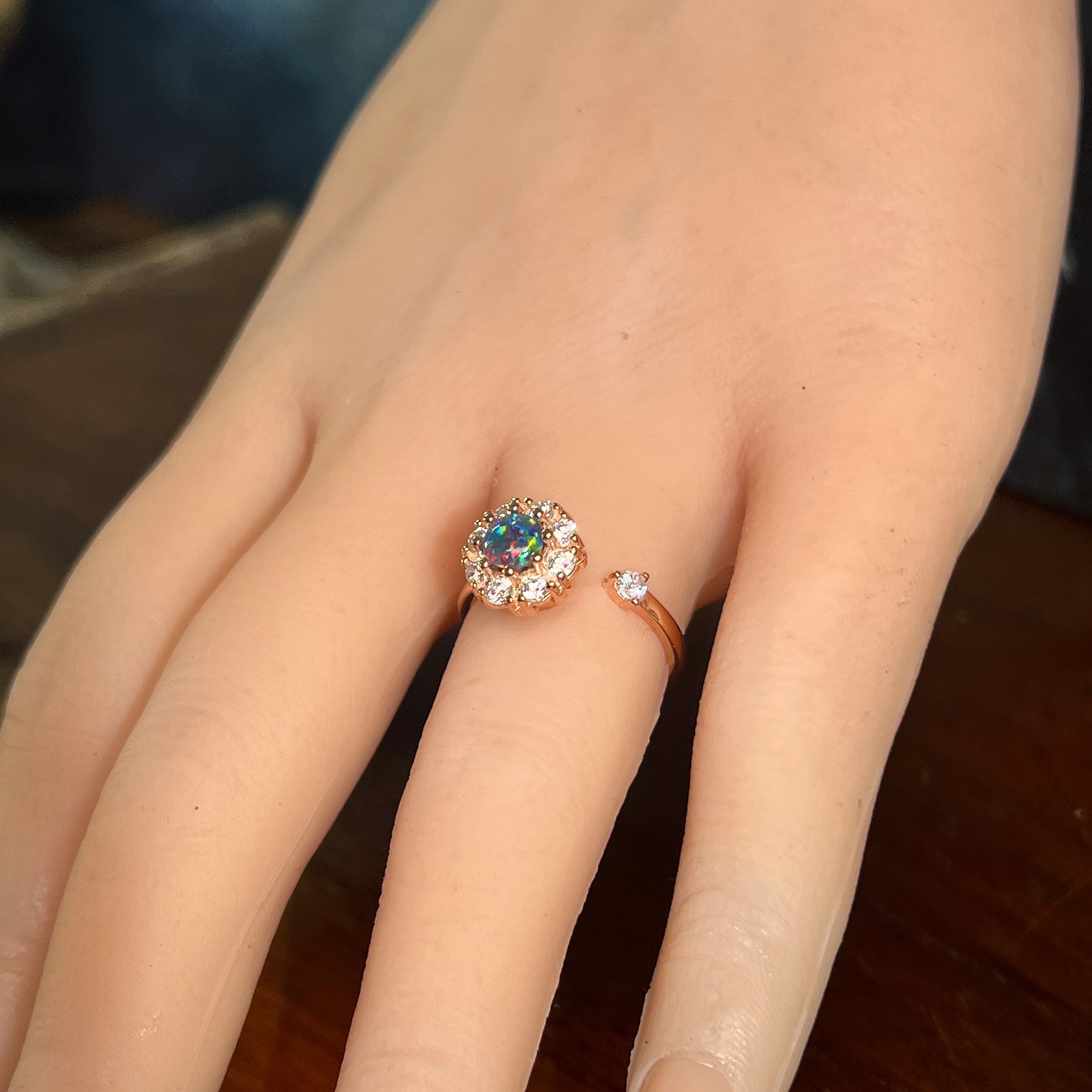 Australian opal triplet ring in rose gold-plated silver worn, round stone, size US 7
