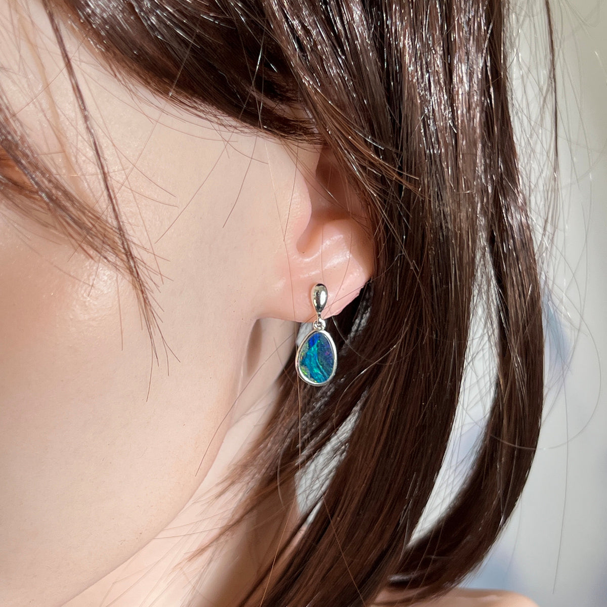 12 x 8.5mm freeform Australian opal doublet earrings worn on the ear, sterling silver