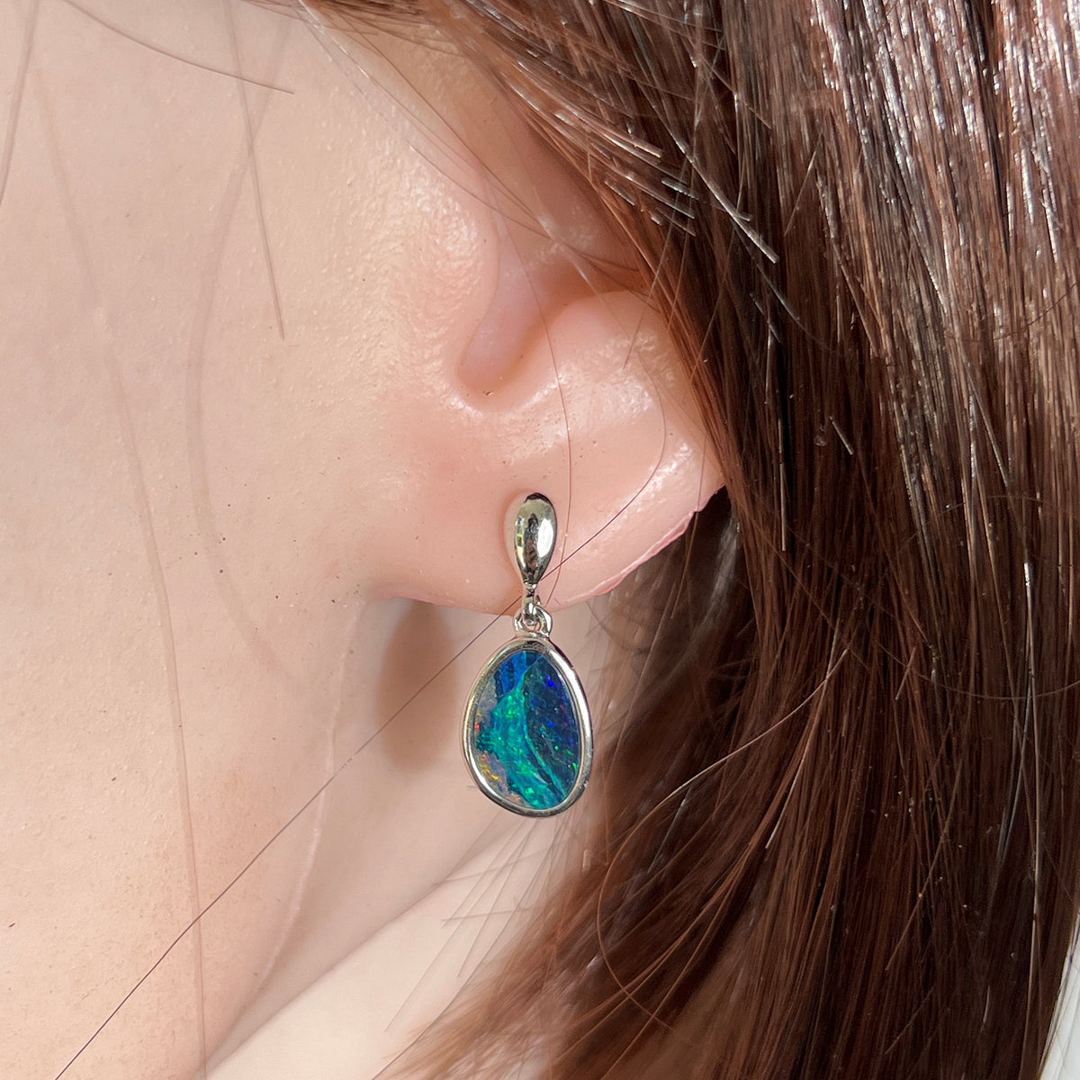 Worn Australian opal doublet earrings in sterling silver, blue, green and pink, 12 x 8.5mm