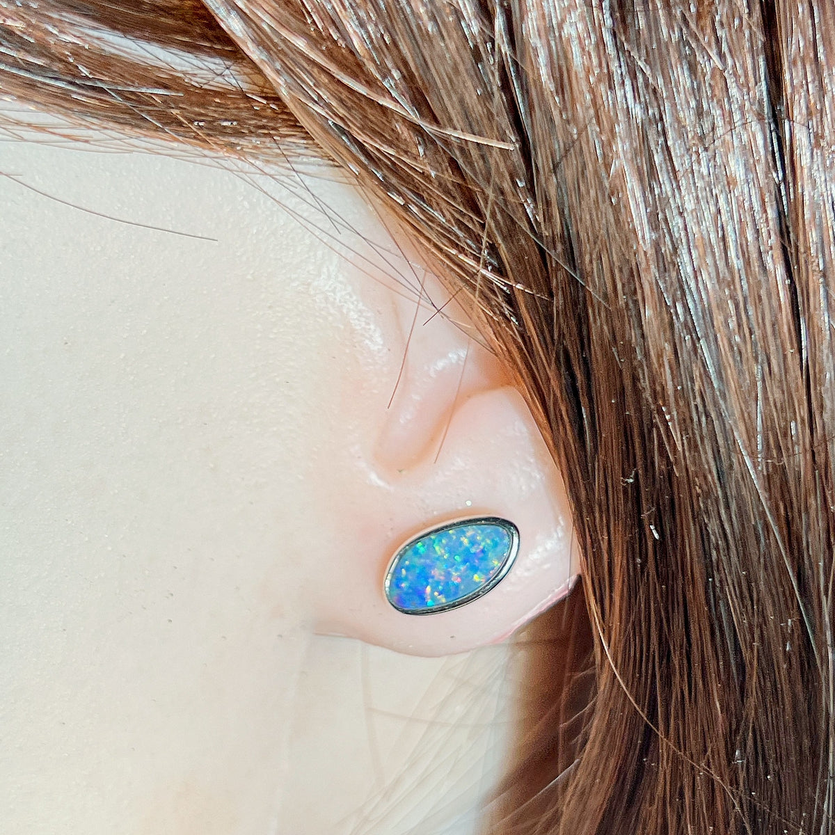Worn Australian opal doublet earrings in sterling silver, red, blue, yellow and green, 12 x 6mm
