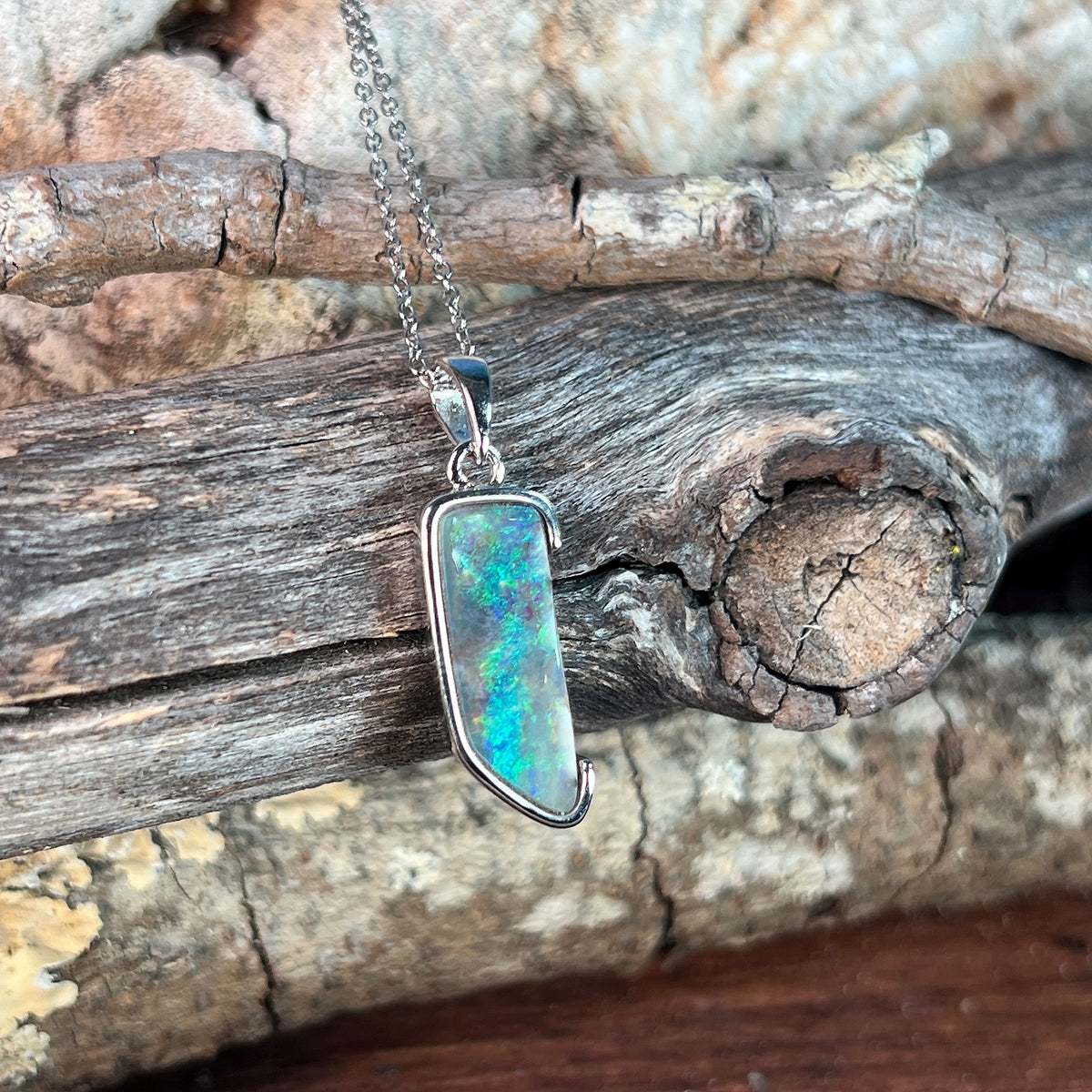 sterling silver Australian boulder opal pendant with an 18 x 7mm freeform stone