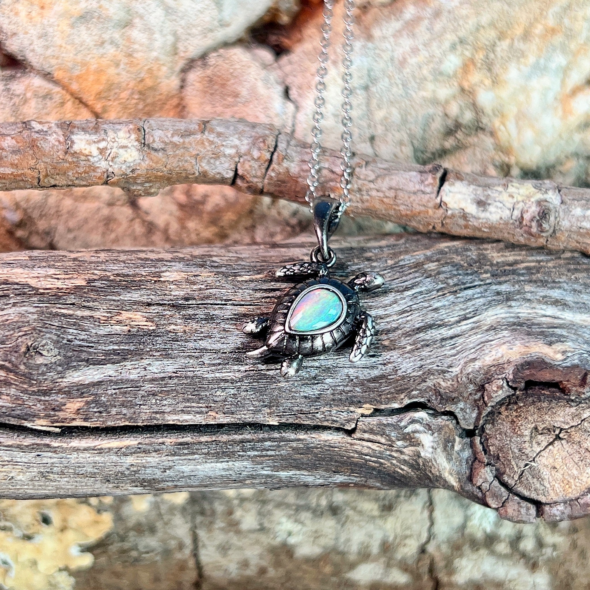 sterling silver Australian crystal opal pendant with a 7 x 5mm pear-shaped stone