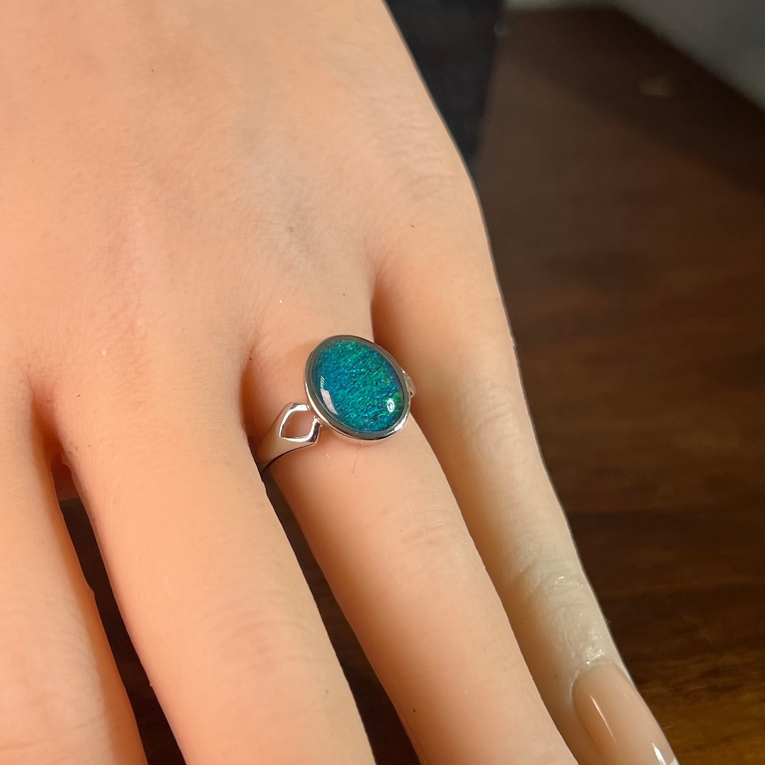 blue and green Australian opal triplet ring on the hand, sterling silver, 12 x 10mm