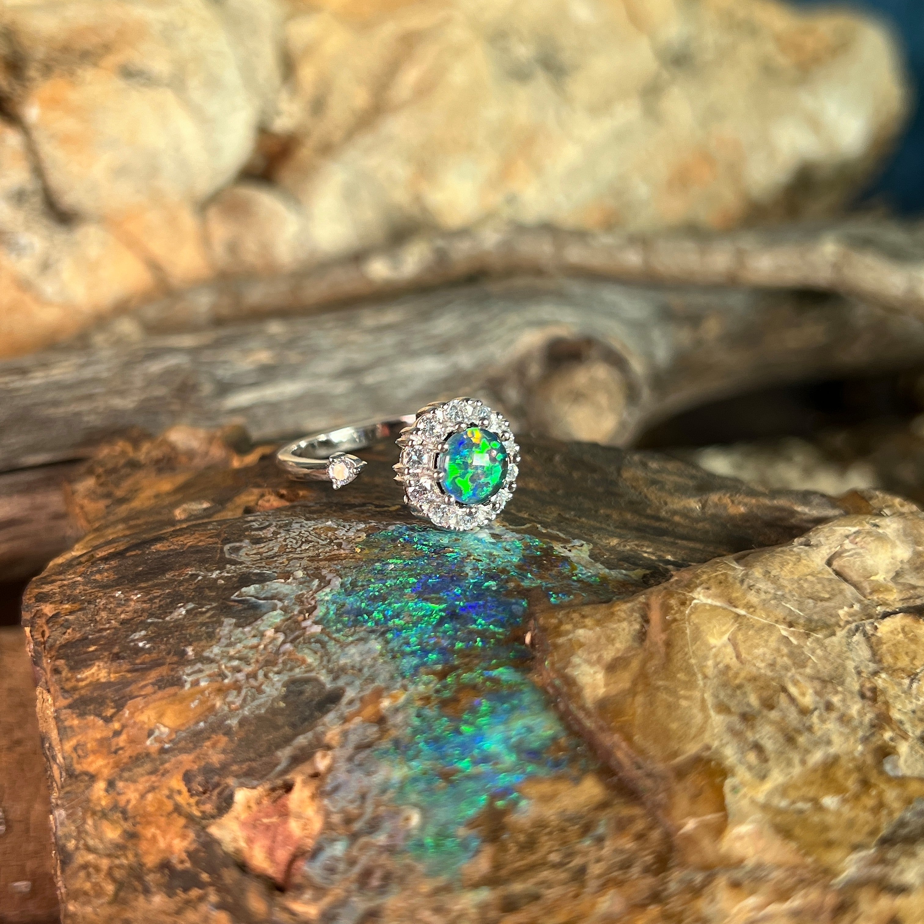 blue and green play-of-colour in a 7mm round Australian opal triplet ring