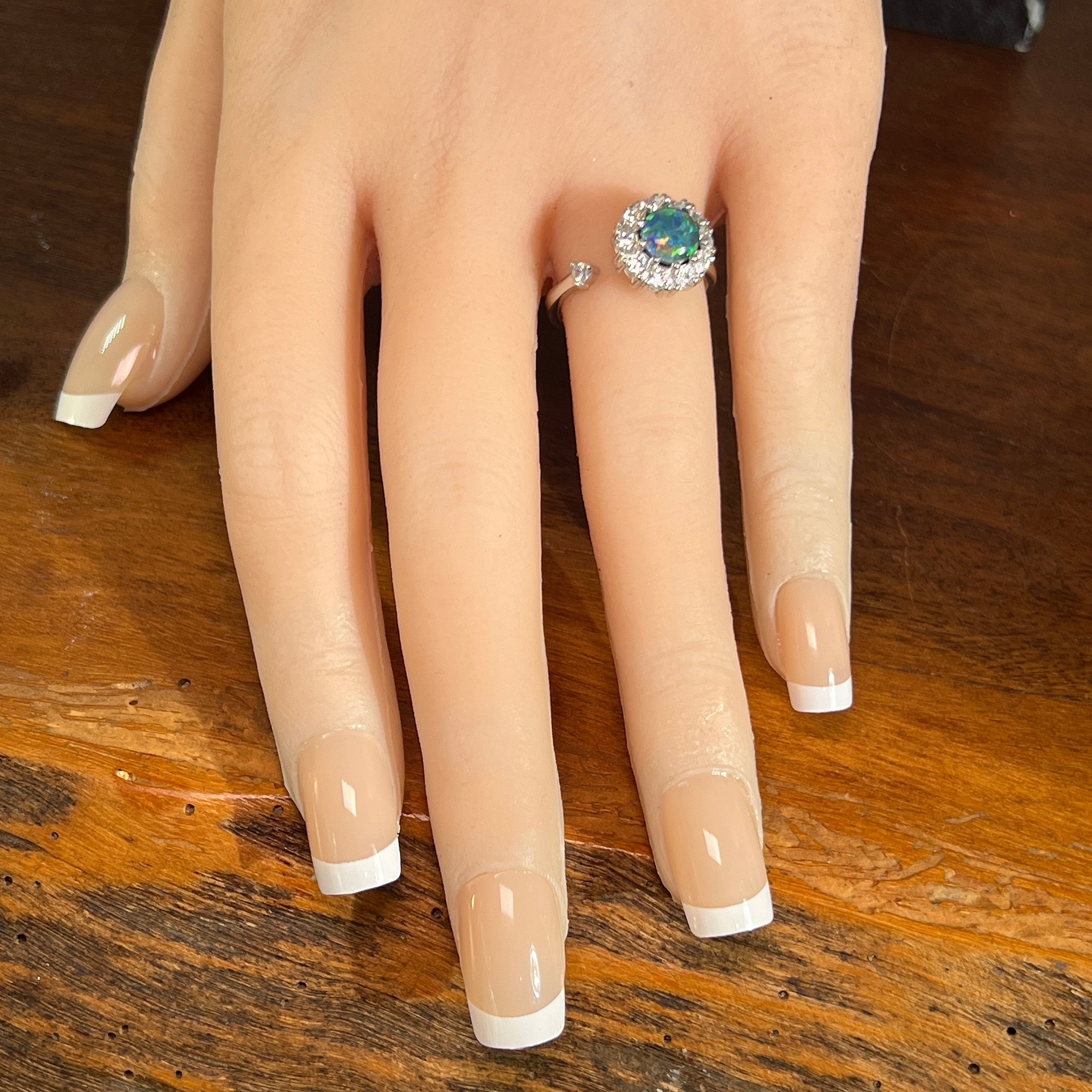 Australian opal triplet ring on the hand, sterling silver, 7mm round stone