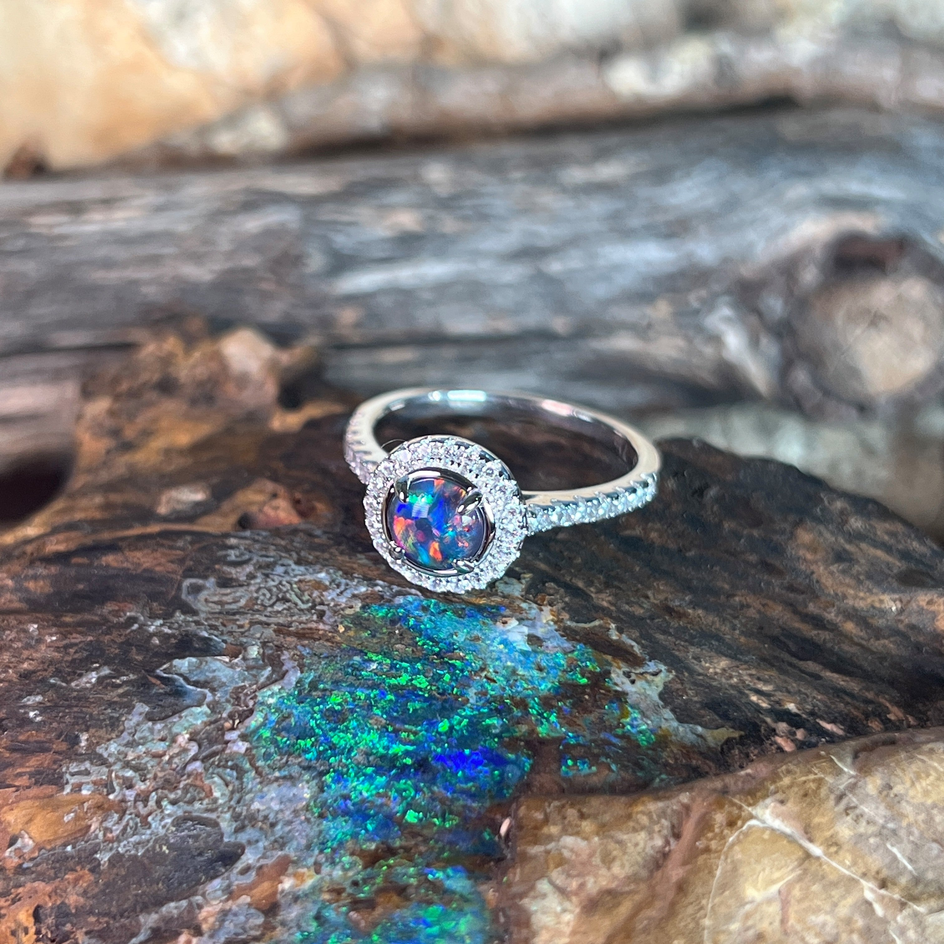 blue and green play-of-colour in a 6mm round Australian opal triplet ring
