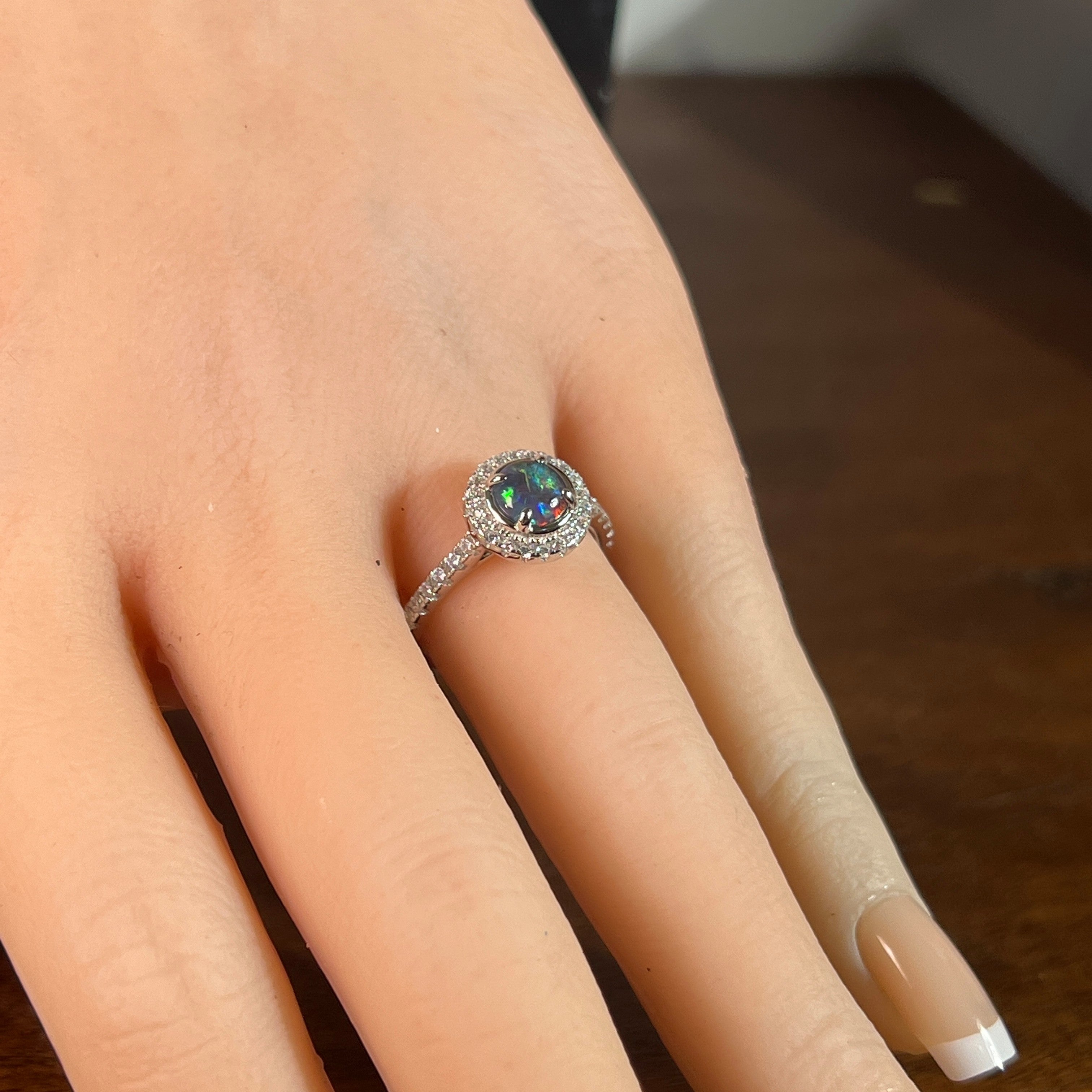 6mm round Australian opal triplet ring on the hand, sterling silver