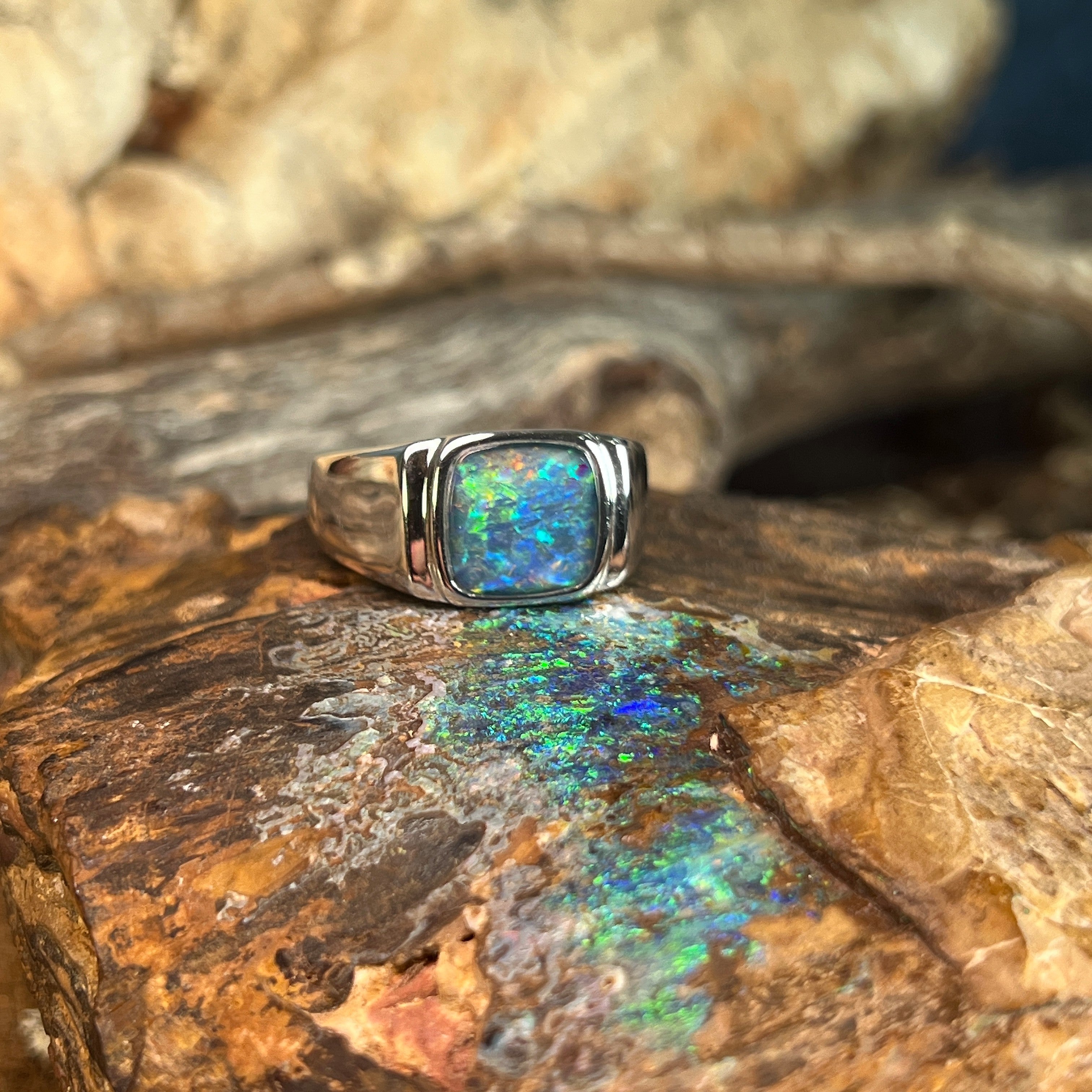 yellow, orange, blue and green play-of-colour in a 10mm square Australian opal triplet ring