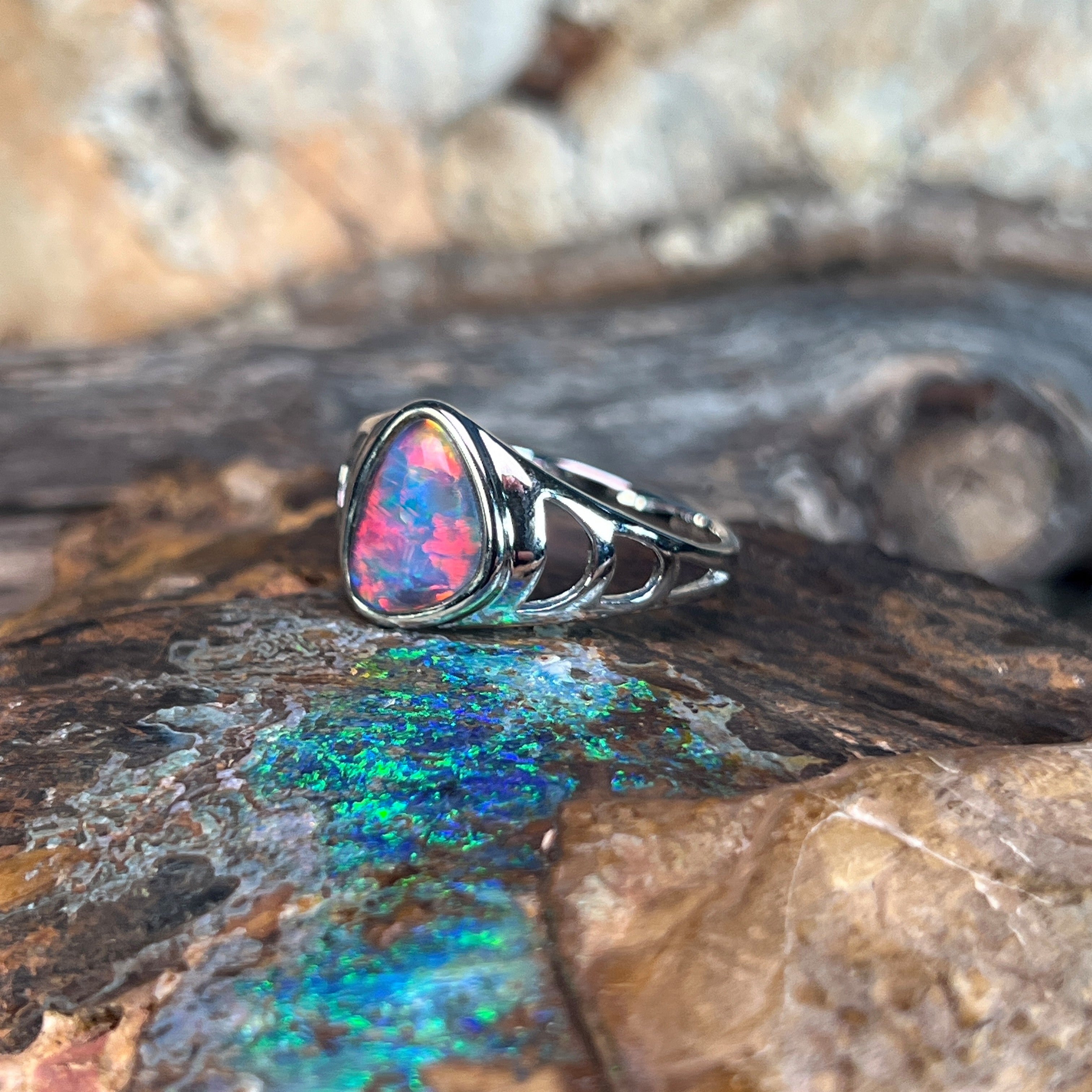 triangular Australian opal triplet ring in sterling silver, red, blue and green play-of-colour