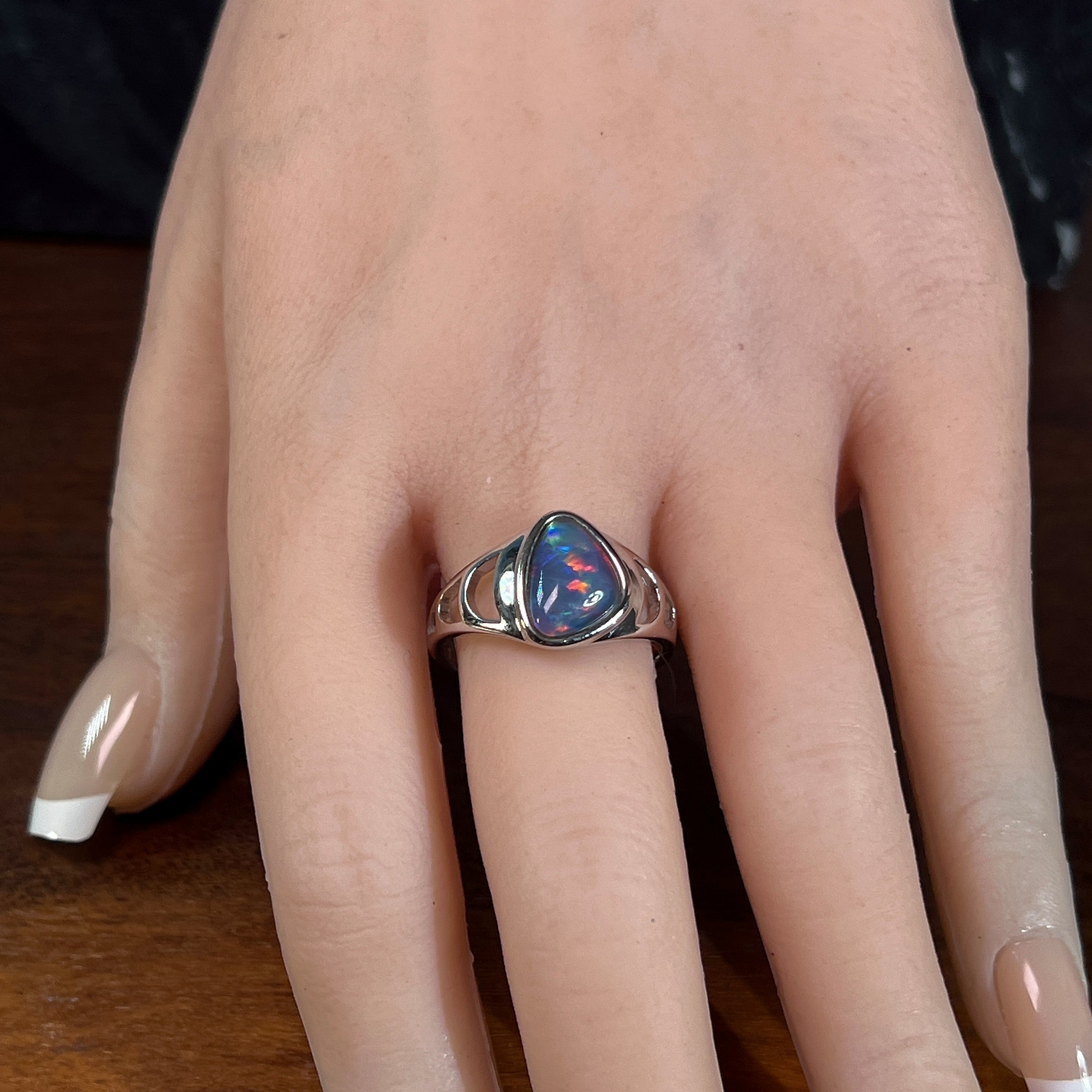 triangular Australian opal triplet ring in sterling silver, worn on the hand
