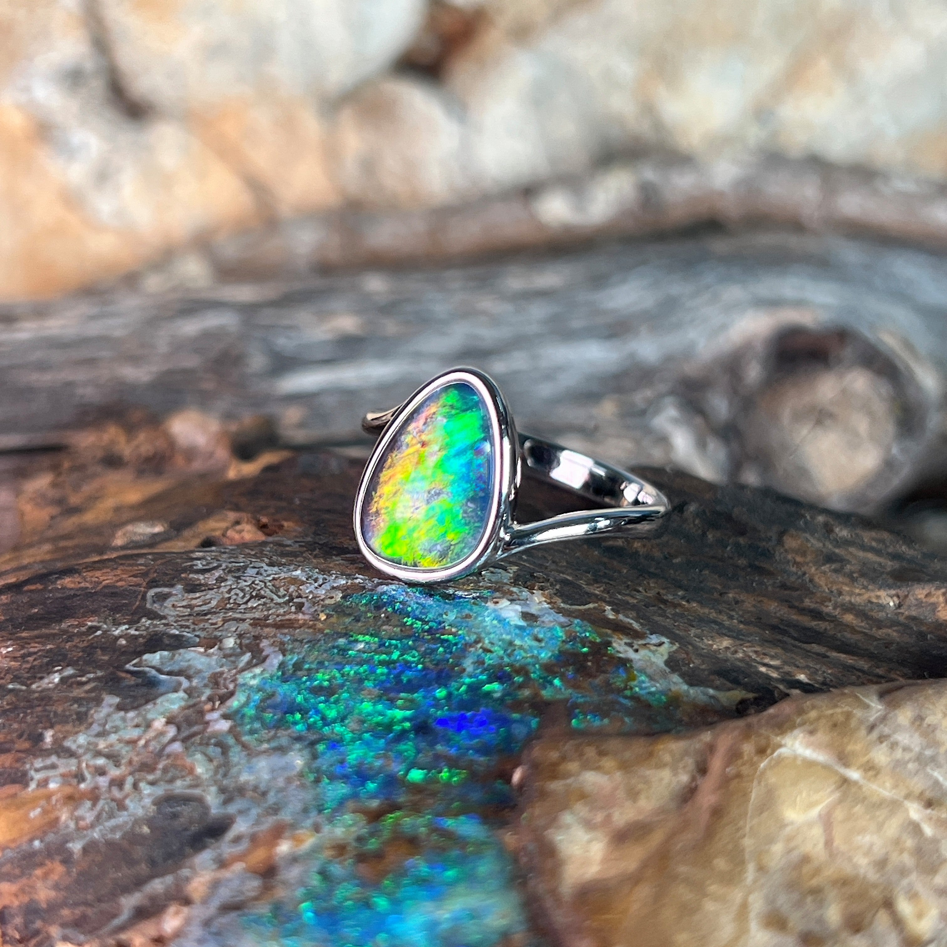 triangular Australian opal triplet ring in sterling silver, red, yellow, blue and green play-of-colour