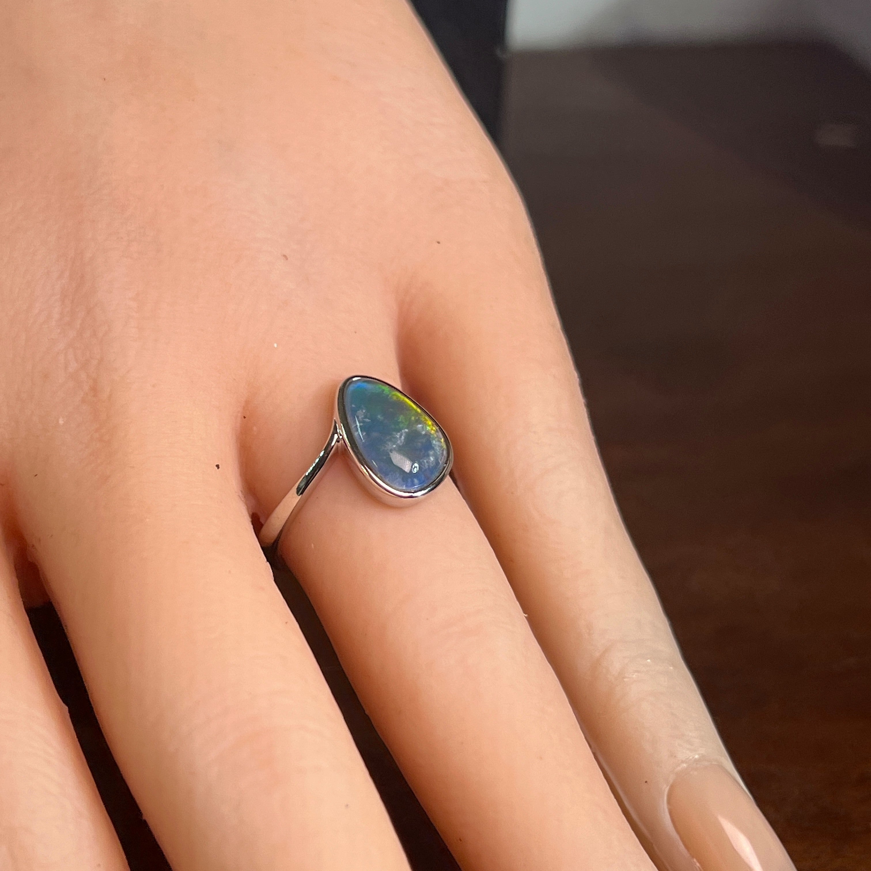 Worn Australian opal triplet ring in sterling silver, red, yellow, blue and green, 12 x 9mm