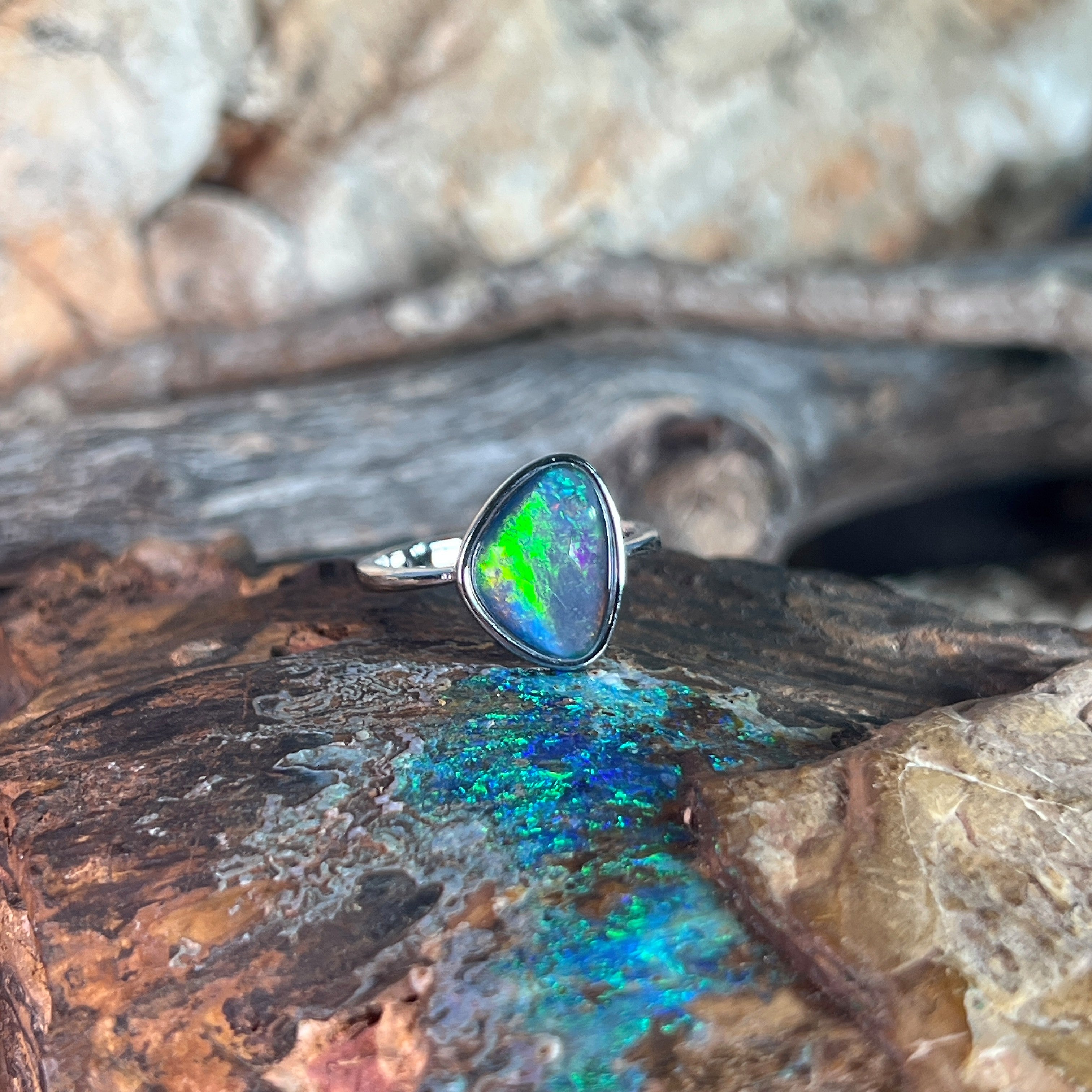 yellow, orange, blue and green play-of-colour in a 12.5 x 9.5mm triangular Australian opal triplet ring