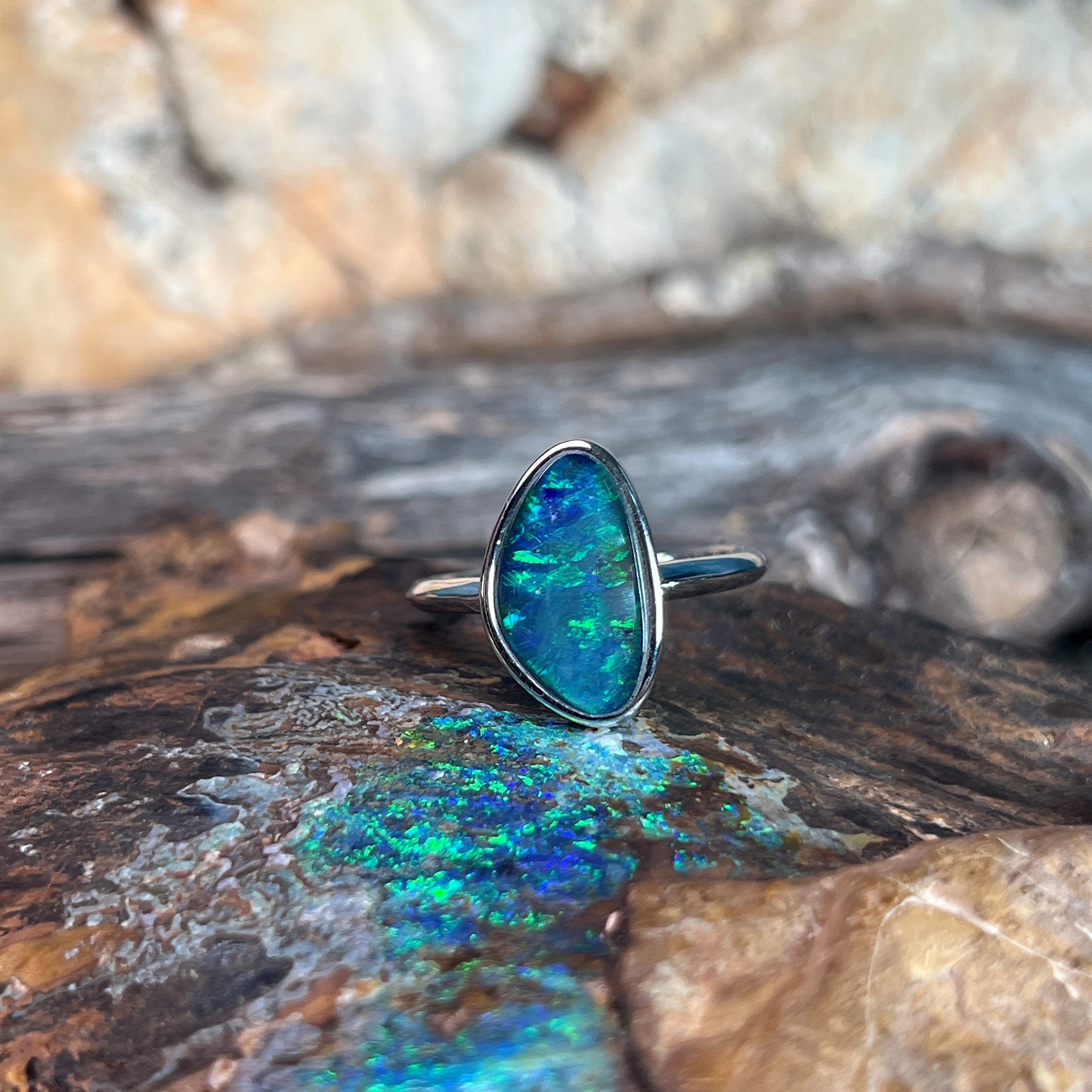 triangular Australian opal triplet ring in sterling silver, yellow, blue and green play-of-colour