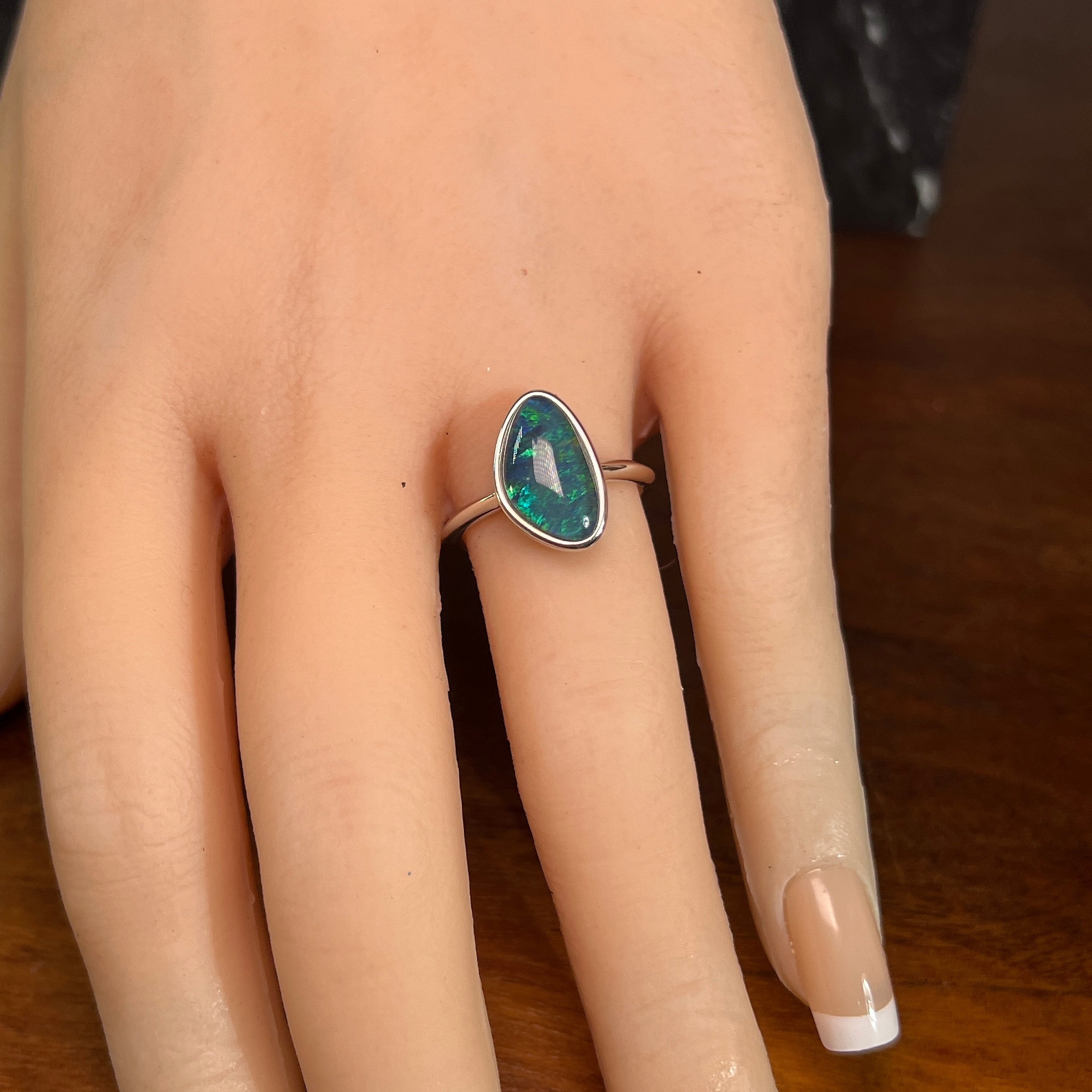 Worn Australian opal triplet ring in sterling silver, yellow, blue and green, 14 x 8.5mm
