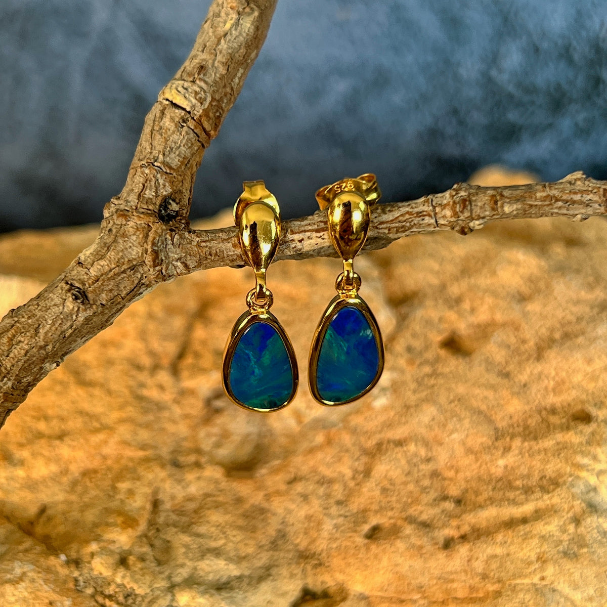12 x 7mm Australian opal doublet earrings in yellow gold-plated silver, green and blue