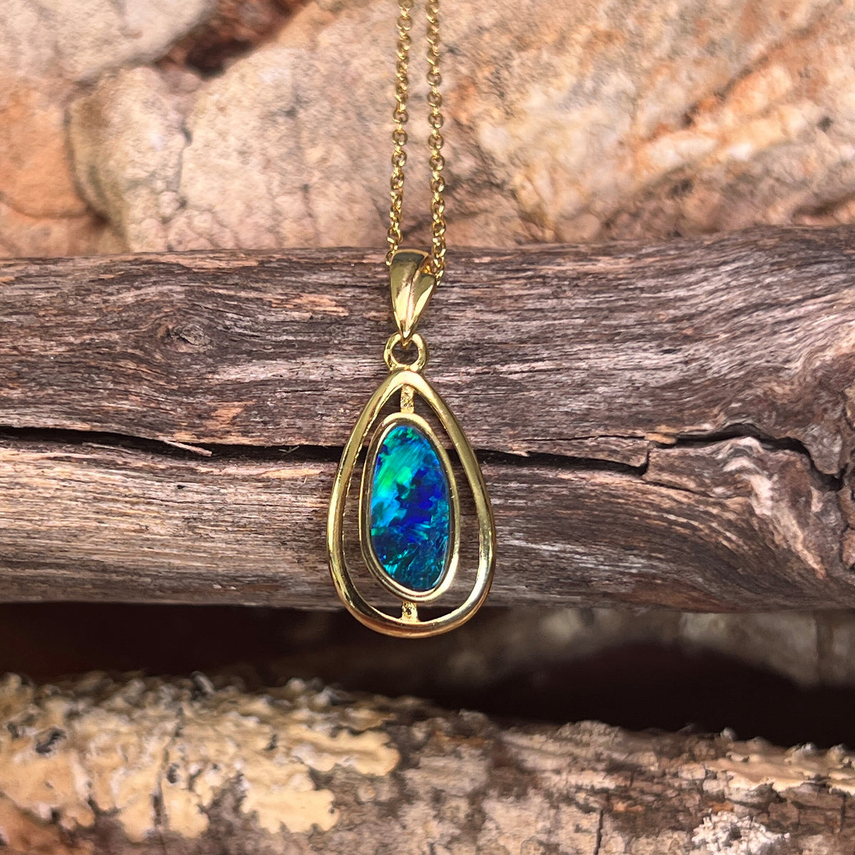 freeform Australian opal doublet pendant in yellow gold-plated silver, blue and green play-of-colour