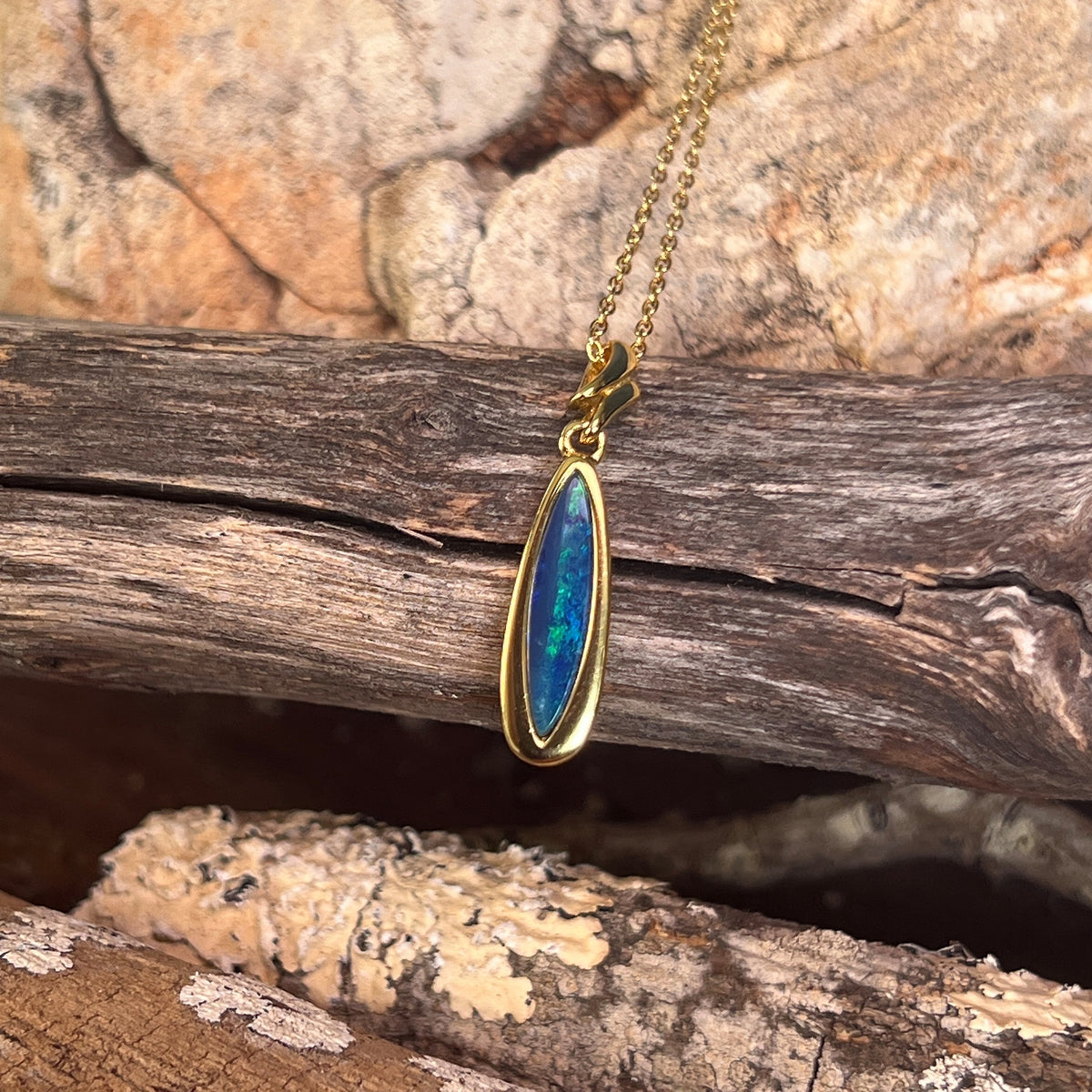 17 x 5mm Australian opal doublet pendant in yellow gold-plated silver, blue and green