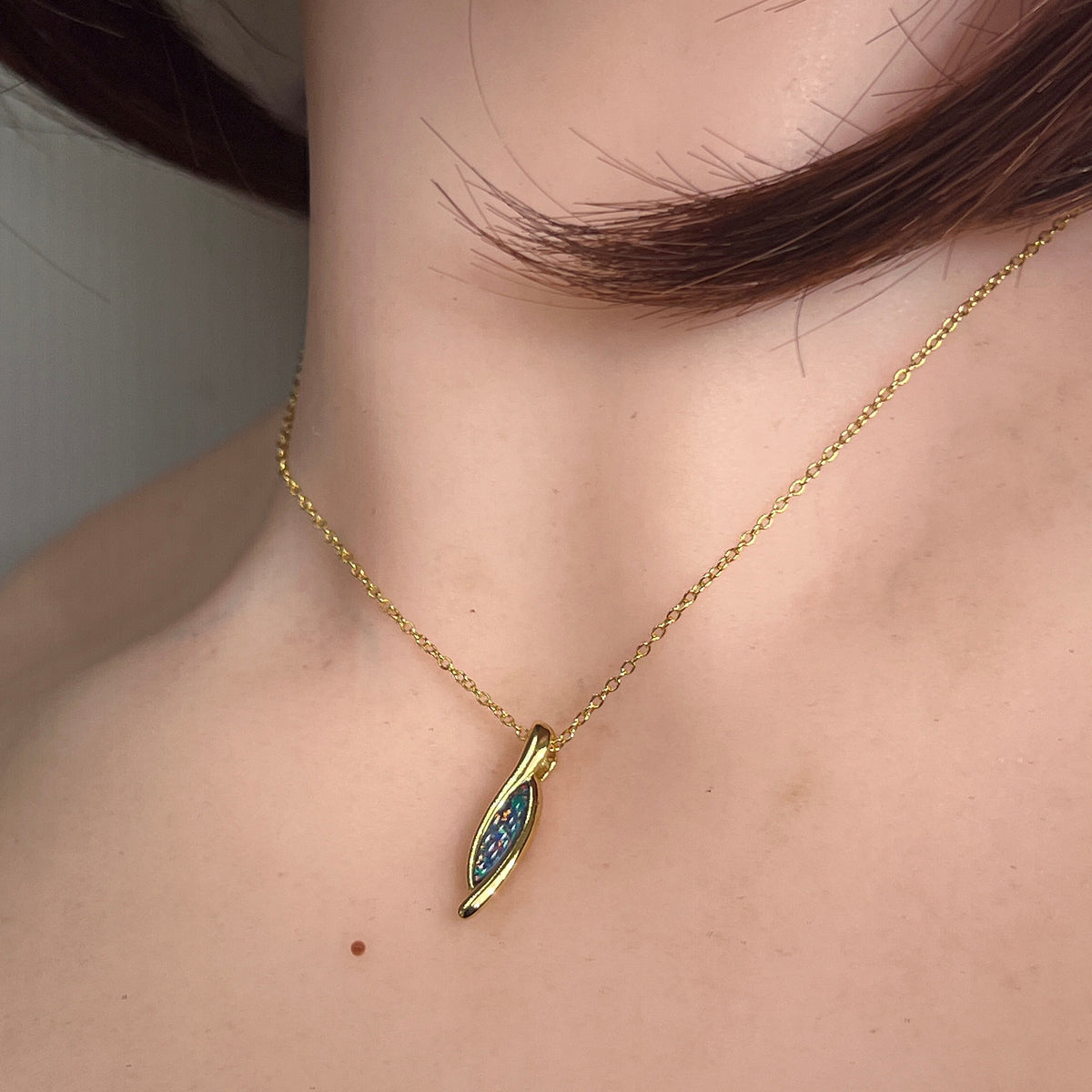 Worn Australian opal doublet pendant in yellow gold-plated silver, blue and green, 12 x 4mm