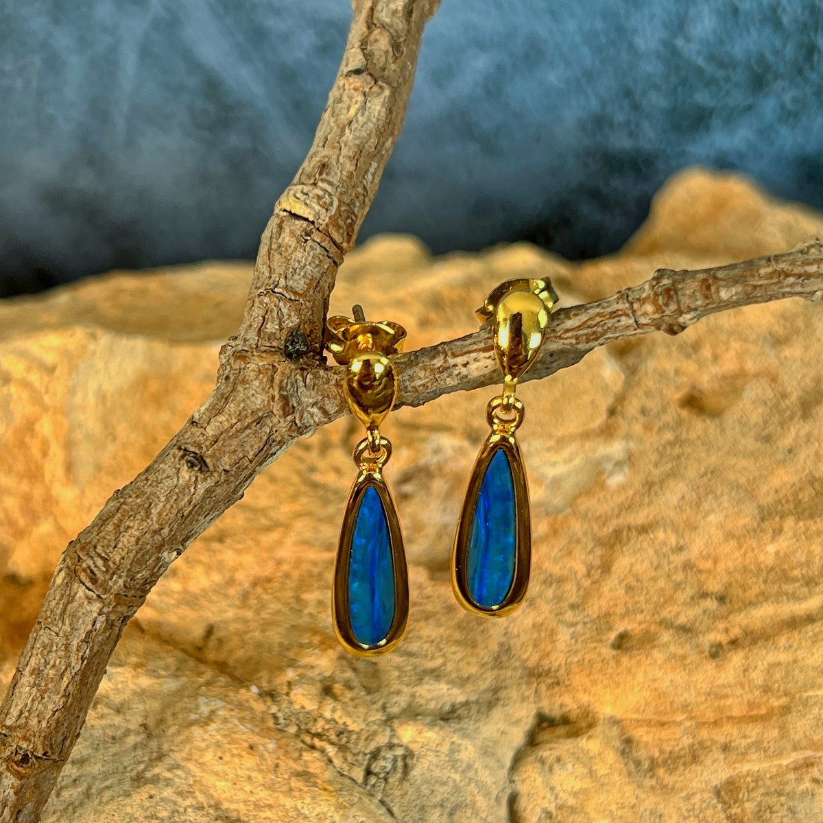 17 x 5mm Australian opal doublet earrings in yellow gold-plated silver, green and blue