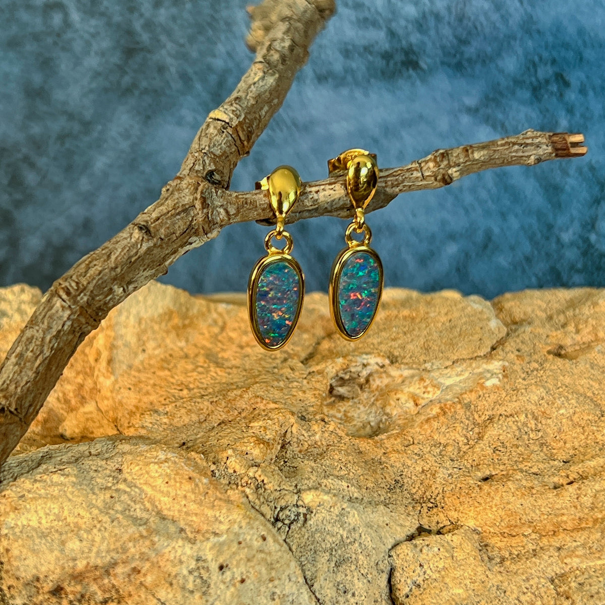 Australian opal doublet earrings, yellow gold-plated silver, 11 x 6mm stones showing red, pink, blue and green