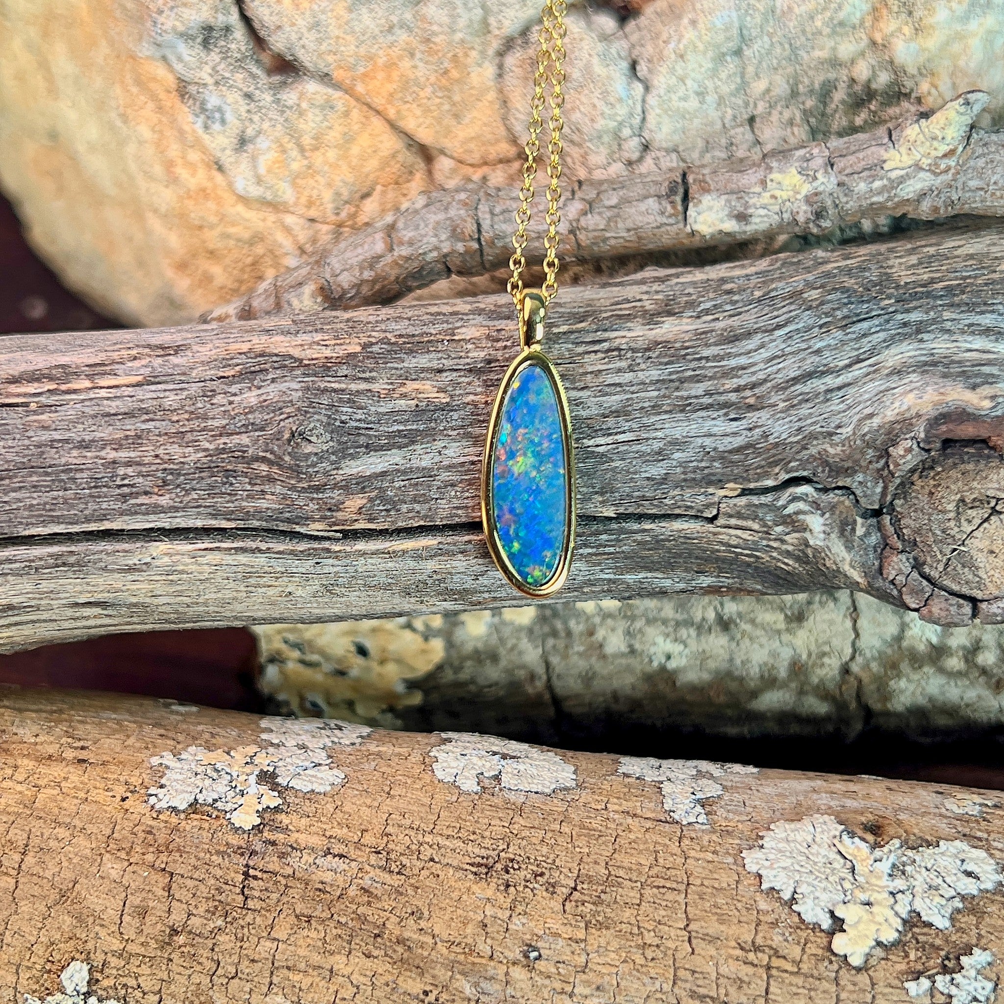 pear-shaped Australian opal doublet pendant in yellow gold-plated silver, blue, red and yellow play-of-colour