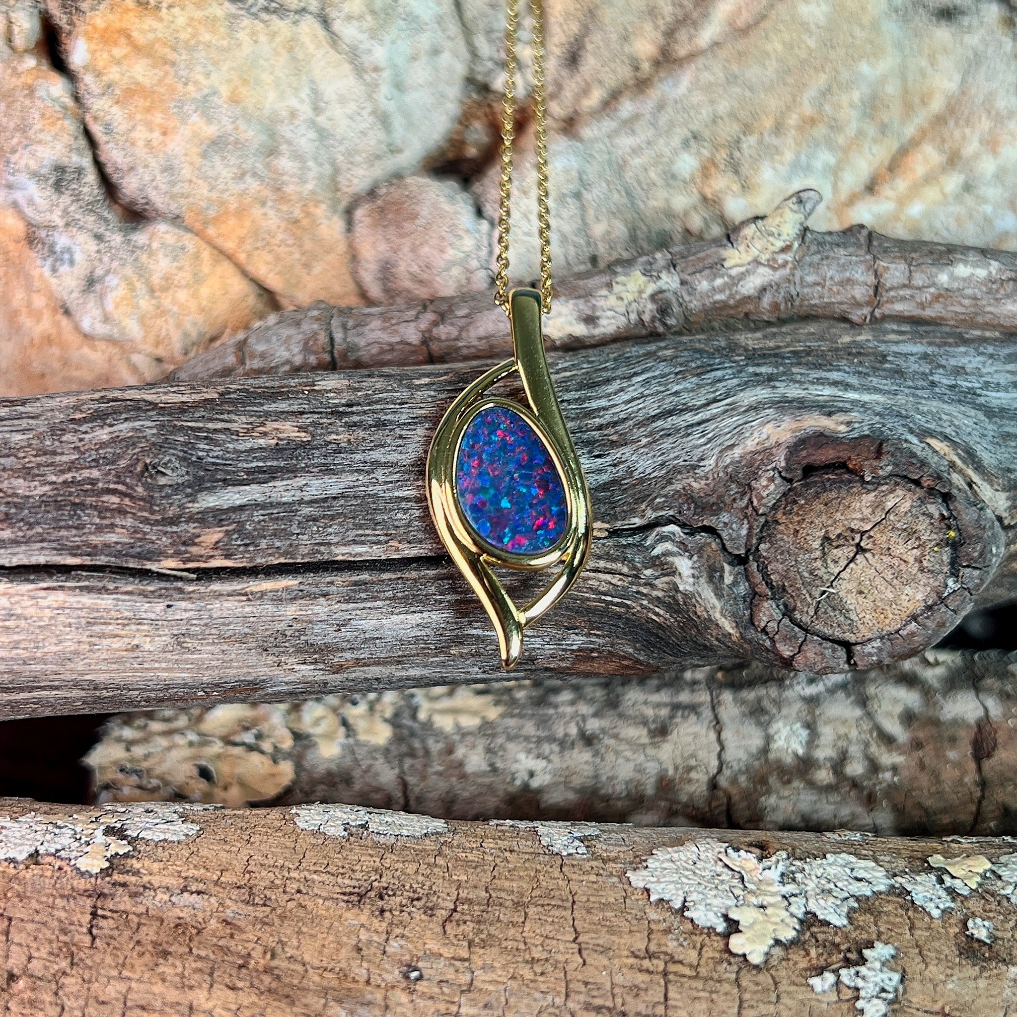 12 x 8mm Australian opal doublet pendant in yellow gold-plated silver, red and blue
