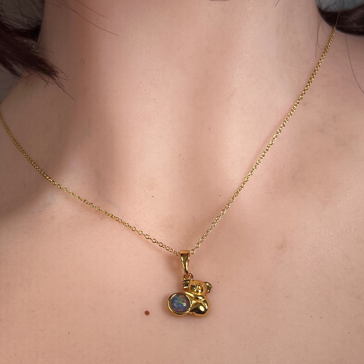 Worn Australian opal triplet pendant in yellow gold-plated silver, blue, red and green, 5mm